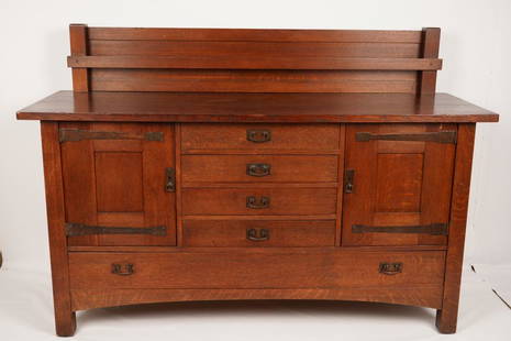 L&JG Stickley Oak Sideboard: Gallery top over 4 short and one long drawer; flanked by two cabinet doors; original hardware; labelled on right interior cabinet door