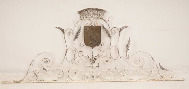 French Wrought Iron Gate Cornice: Elaborate wrought iron design centering a bronze family crest on both sides.