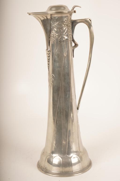 Pewter Art Nouveau Claret Jug for Liberty: Walter Scherf & Co. c 1900. Decorated with vine leaves and grapes. Marked "Osiris" on the base. Liberty London. From the V&A Christmas catalog in 1900.