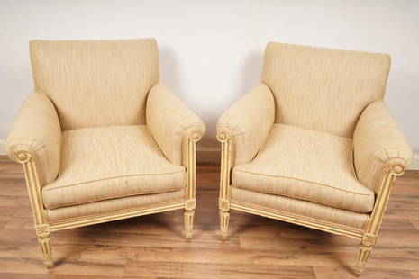 Pair Louis XVI Style Upholstered Bergeres: Upholstered in a tan raffia on a cream/white painted frame on tapered legs. Purchased in Paris, France.