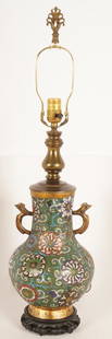 Chinese Cloisonne Table Lamp: Vase form with two handles on a carved wooden base with overall floral decoration.