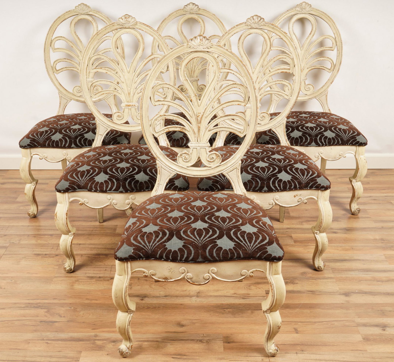 Six Painted Provincial Style Dining Chairs: Each painted with a patinated white finish, upholstered in a brown and turquoise foliate pattern. Excellent condtion. Each chair H 43" x W 23 1/2" x D 21"