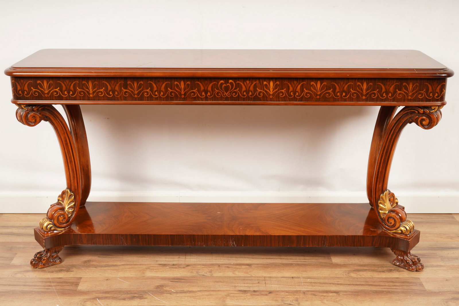 Regency Style Parcel Gilt Console Table: One (1) Console Table with claw feet. H 32" x W 62 1/2" x D 17 3/4".