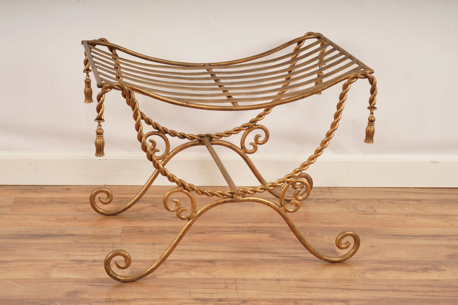 Gilt Metal Bedroom Stool: One (1) Metal Seat. Gold color. H 20 1/2" x W 26 /2" x D 16 1/4". Lacking cushion.