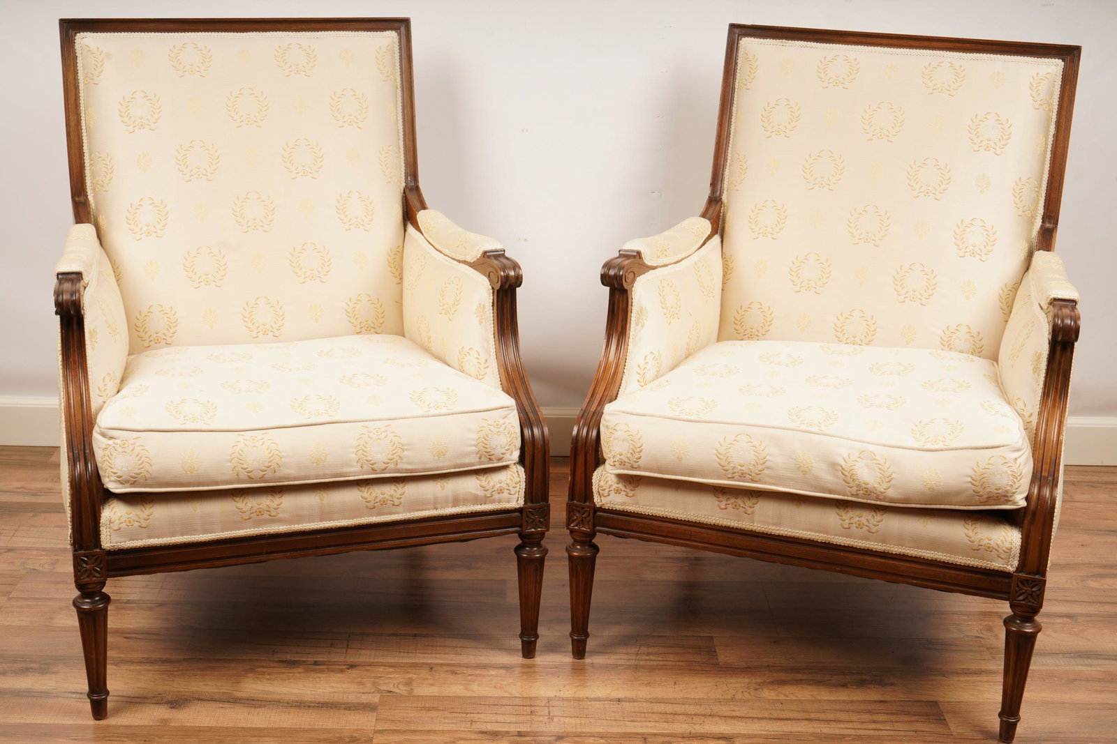 Pair Louis XVI Upholstered Bergeres: H 36.25” x W 28” x D 30” The net proceeds from this lot benefit womenâ€™s charities.