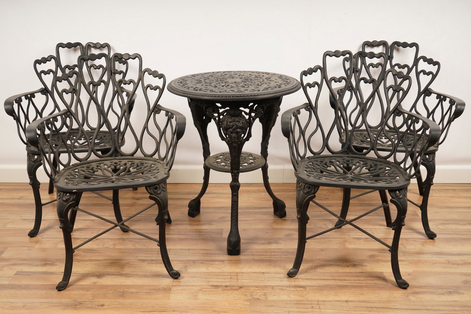5 Piece Cast Iron Patio Table Chair Set: Table 28x23” Chairs H 32.5” x W 22.75” x D 23” The net proceeds from this lot benefit womenâ€™s charities.