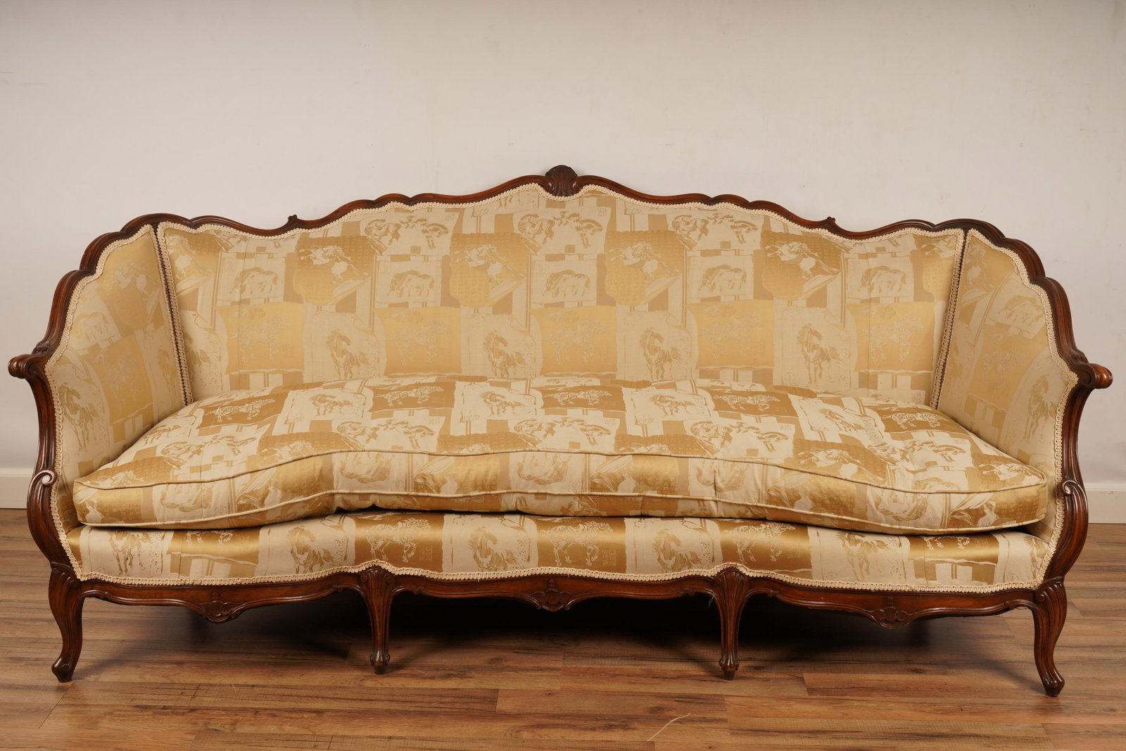 Louis XV style gold Upholstered sofa: H 36” x W 83” x D 35” The net proceeds from this lot benefit womenâ€™s charities.
