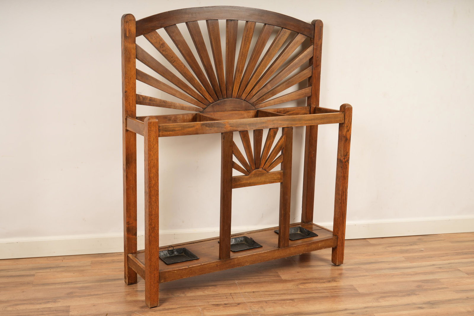 Southwestern Style Umbrella Stand: Constructed with a sunrise design over three compartments for umbrellas or canes. H 50.25 W 42 D 11.75