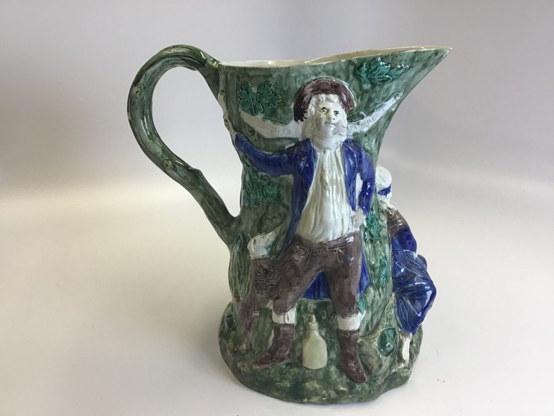Large Fair Hebe Staffordshire Pearlware Pitcher 1788-1790 Voyez: Modelled by Jean Voyez with three figures in high relief against an oak tree, a gentleman standing on one side, a bottle impressed RG at his feet and a dog jumping up beside him, a ribbon impressed 'A