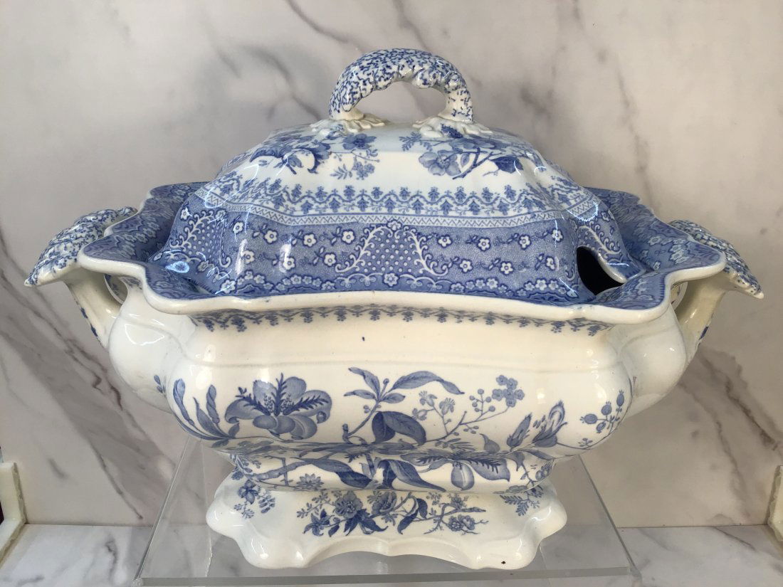 English Light Blue Staffordshire Soup Tureen "Asiatic Flowers": Robust form with large handles and a scalloped footed base.