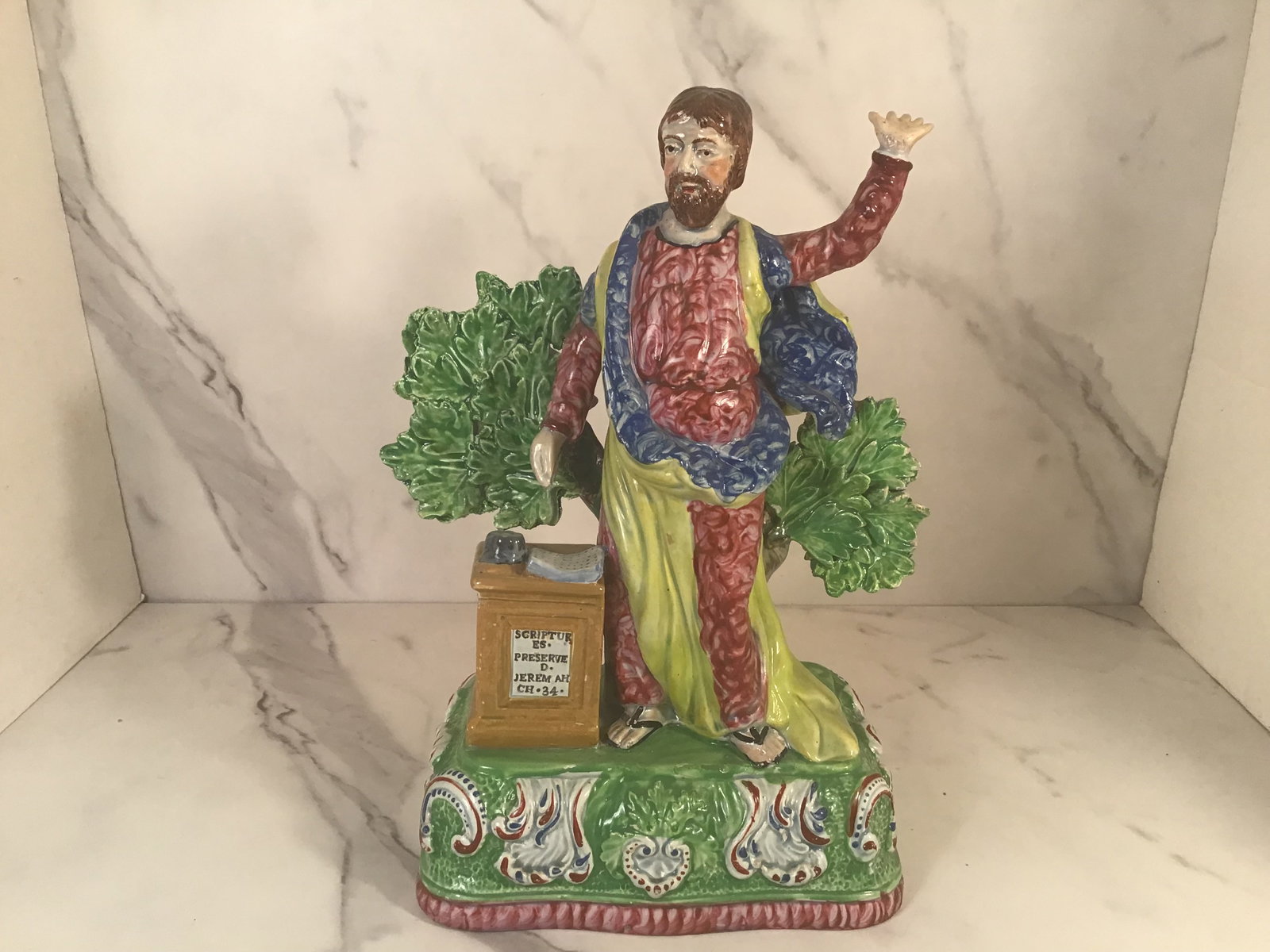 Early English Staffordshire Pearlware Figure of Jeremiah Bocage: Large and elaborately decorated figure of Jeremiah preaching with flowing robes, bocage backdrop. Raised on a highly ornamented polychrome base. 10.5 Inches tall