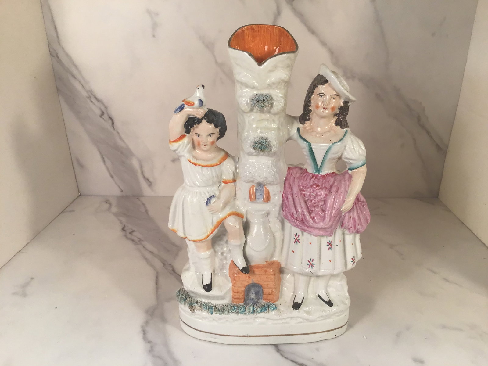 English Staffordshire Spill Vase Two Young Women Fireplace: 10" Tall. An unusual form depicting two females flanking a fireplace stove and centering a slaw decorated chimney.