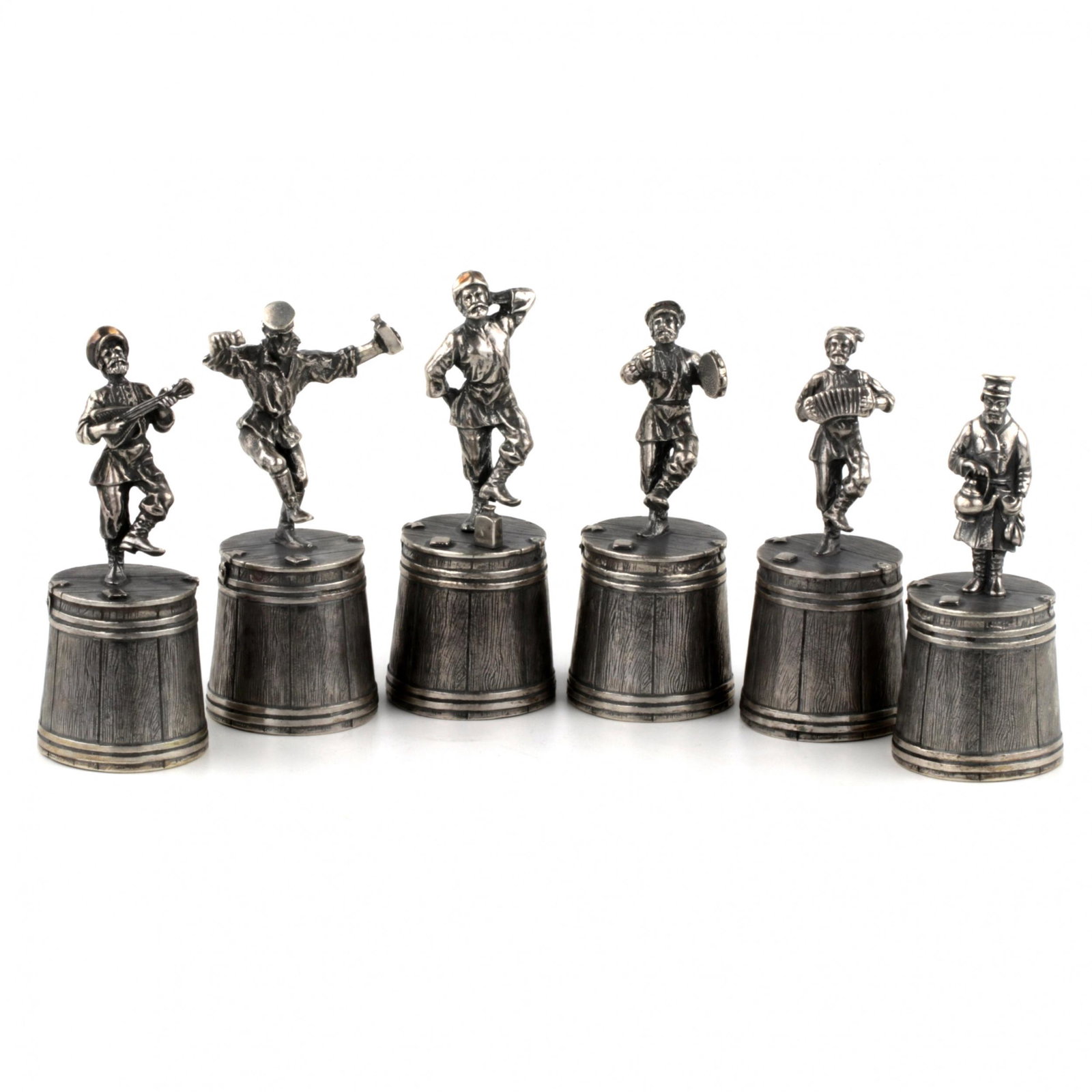 Set of silver glasses "Dancing man". Russia.: A set of silver glasses from the "Holidays" series: "The Dancing Man". It consists of six broken dancing figures on inverted wooden buckets / feet, invoking daring fun. Hallmarks: letters A.A, numbers