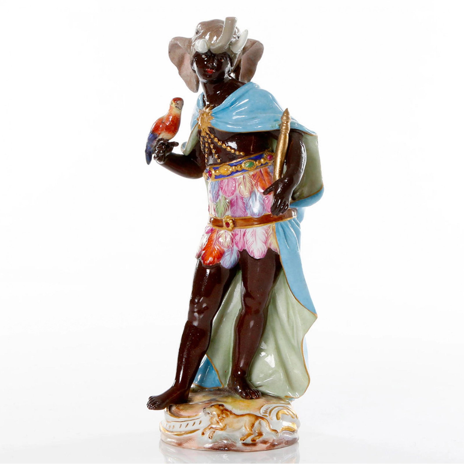 Figurine - allegory "Africa", Meissen: Porcelain figure allegory "Africa" from the cycle of continents. Meissen 19th century. Depicts a dark-skinned king with a scepter and a parrot in his hands; in an elephant head hat, precious stones an