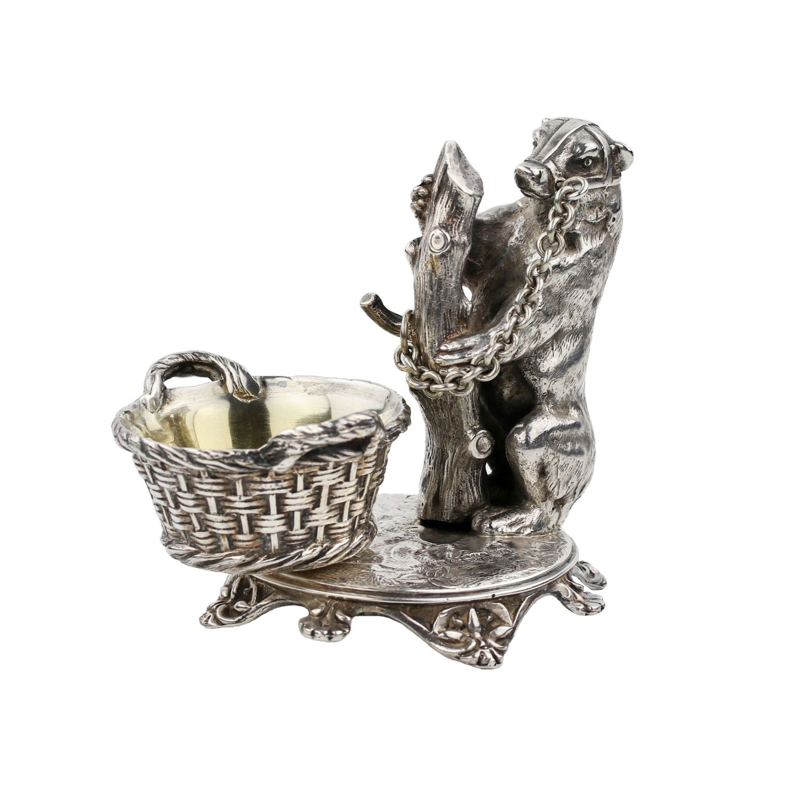 Witty, silver salt shaker with a bear, workshop Grachev.1889: A witty silver salt-cellar with an image of a bear tied to a tree trunk by a chain, Grachev`s workshop, mark of master Johan Olsonius, St. Petersburg, 1889. The salt bowl is made in the form of a bask