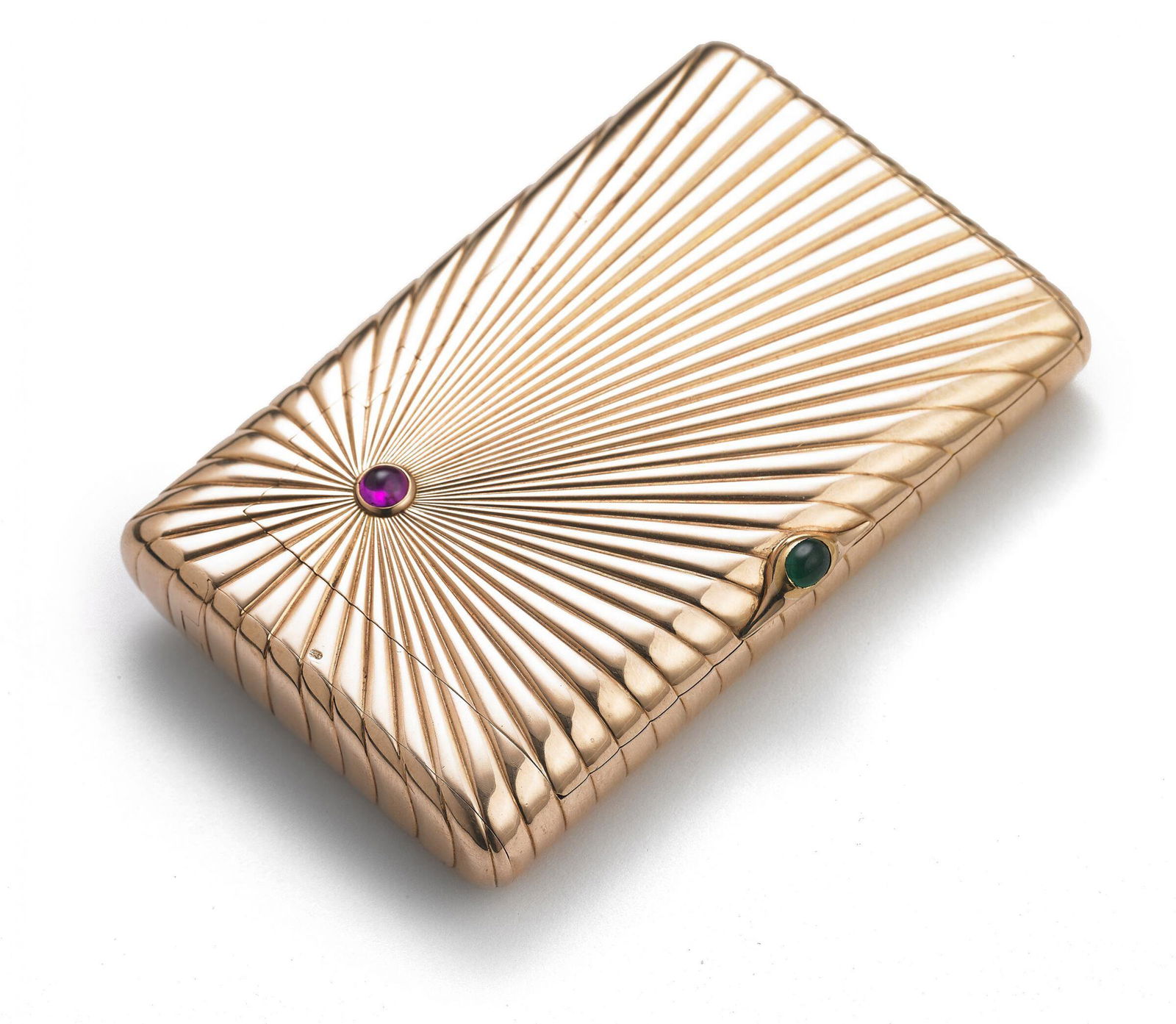 Russian cigarette case "Sunrise" from 14-K gold. Carl Faberge. Saint Petersburg: Voskhod Russian cigarette case in 14k gold, encrusted with a cabochon ruby on the front and an old-cut diamond on the back, cabochon emerald lock, two-part interior filling with an insert including an