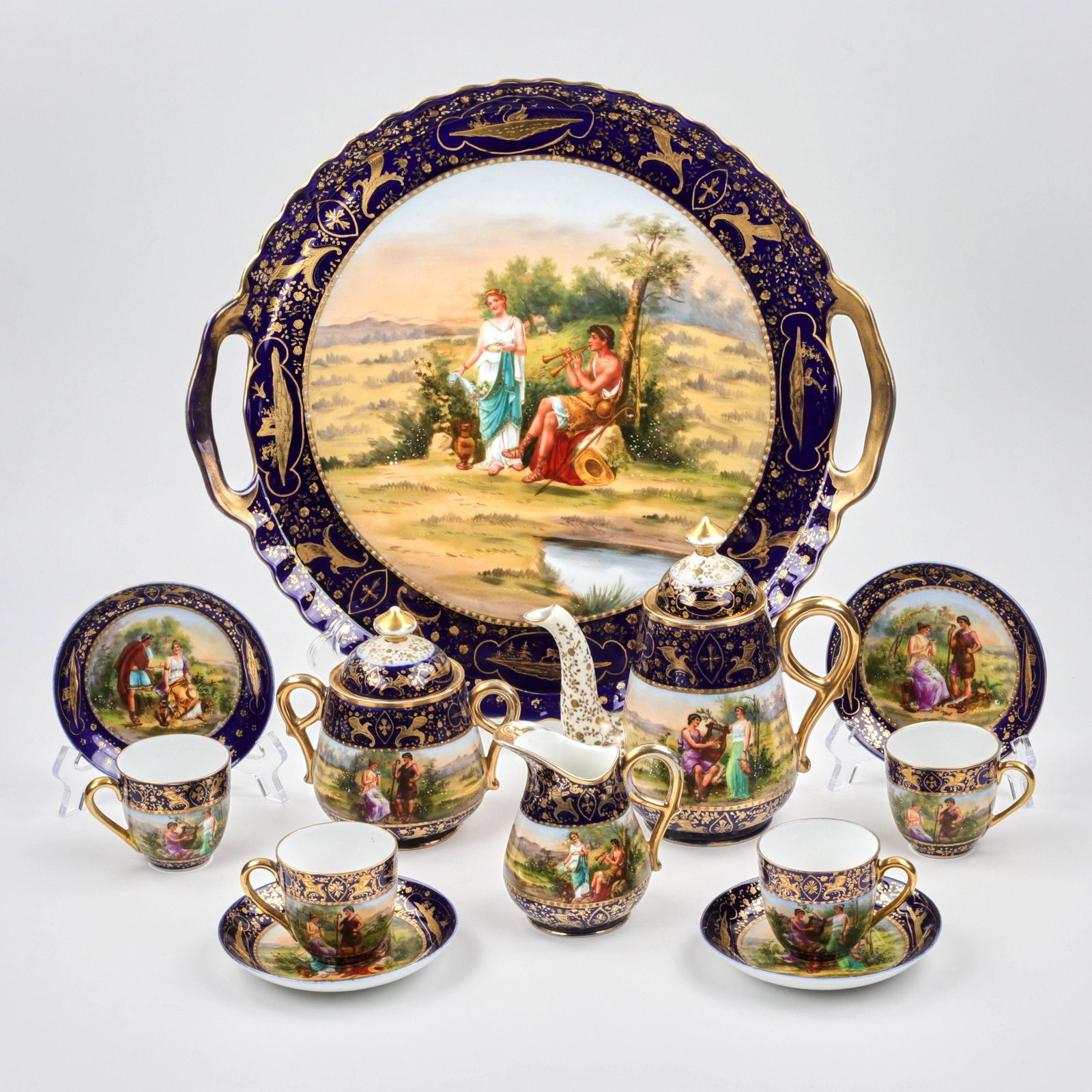 Coffee service.: Cobalt, coffee service with mythological painting, consisting of a tray, a sugar bowl, a milk jug, a coffee pot and four cups with saucers. Vienna manufactory, late 19th century. It attracts with scen