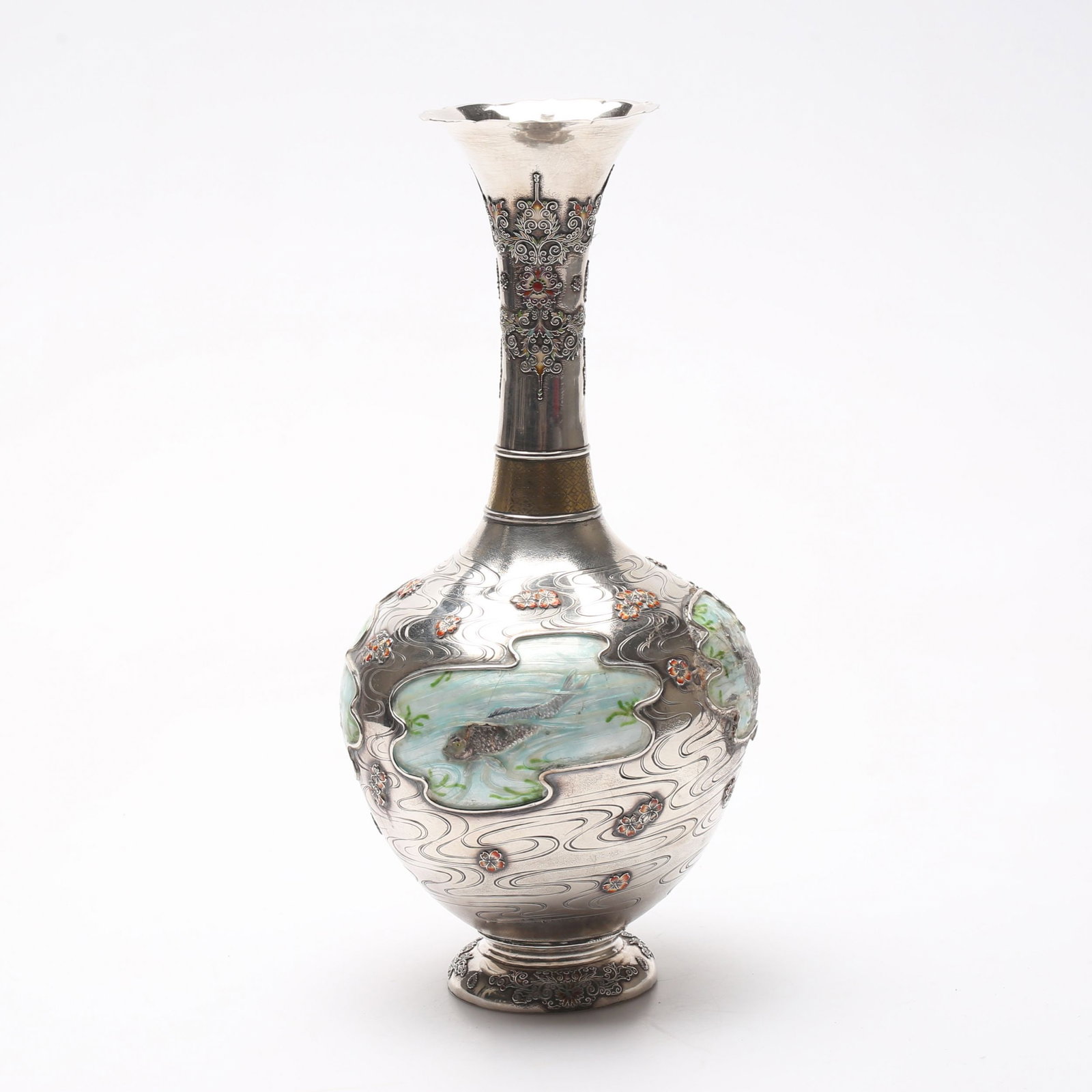 Silver vase with enamel from the Meiji period. 1868 - 1912. Japan: Silver Japanese vase with enamel, dedicated to the water element. The decor of the vase includes 4 patch vignettes depicting fish. Water jets are decorated with lily flowers. Based on a hieroglyphic m