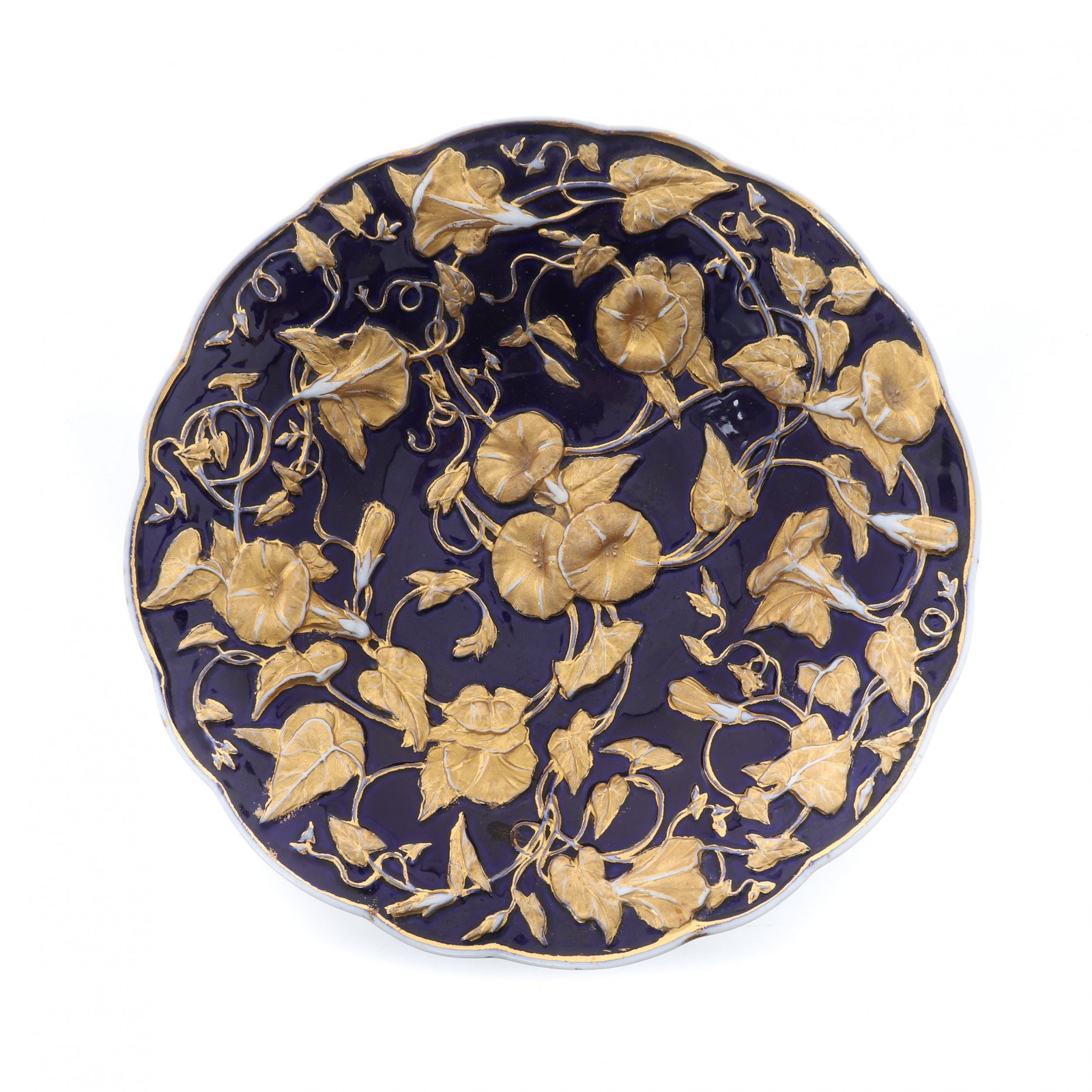 Cobalt blue and gold porcelain dish. Meissen. 20th century.: A deep decorative dish made of Meissen porcelain, where the plant ligature of shoots and flowers sounds favorably against the background of blue cobalt. Blue underglaze swords. Germany. Second quarter