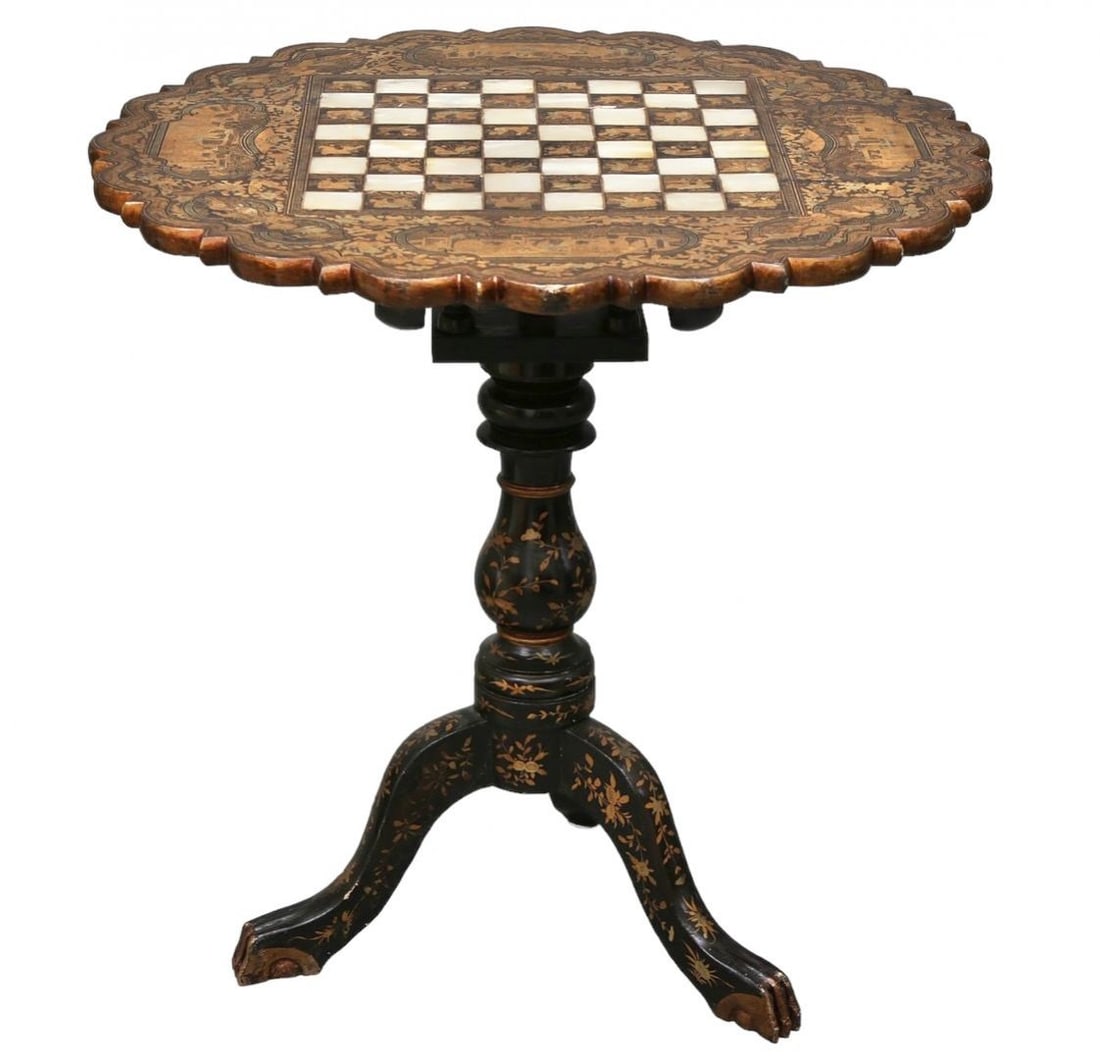 Chess table of exquisite workmanship. China. 19th century.: Chess table of exquisite workmanship. China. 19th century.Chess table on a bell-shaped tripod and baluster support, with a round figured and folding tabletop, richly decorated with gold decor over bla