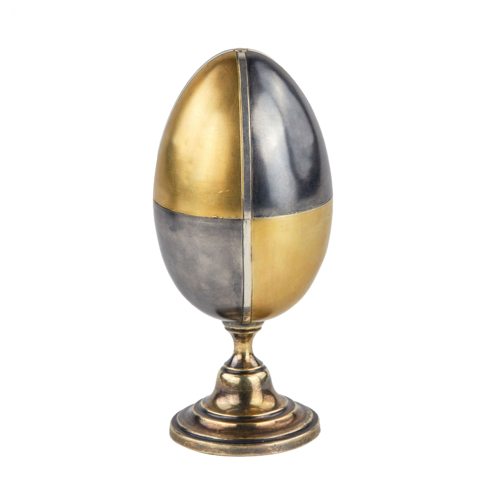 Silver egg. Eric Collin. Faberge firm.: Poached egg made of silver with gilding. The everyday item originally includes in one Easter volume - a pair of integral egg holders. Lapidary gilding of the slices allows you to combine patterns, inc