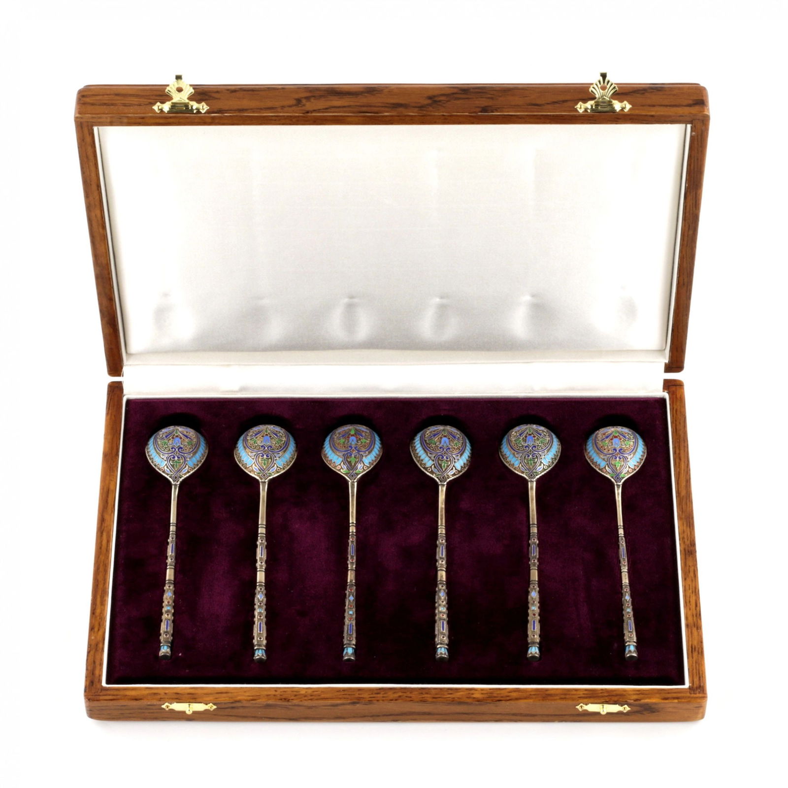A set of Grachev`s teaspoons in their own case.: A set of 6 Grachev`s teaspoons in its own case. St. Petersburg, last quarter of the 19th century. Cloisonne enamel on sterling silver 88. Master AP. A distinctive feature of Russian Art Nouveau and th