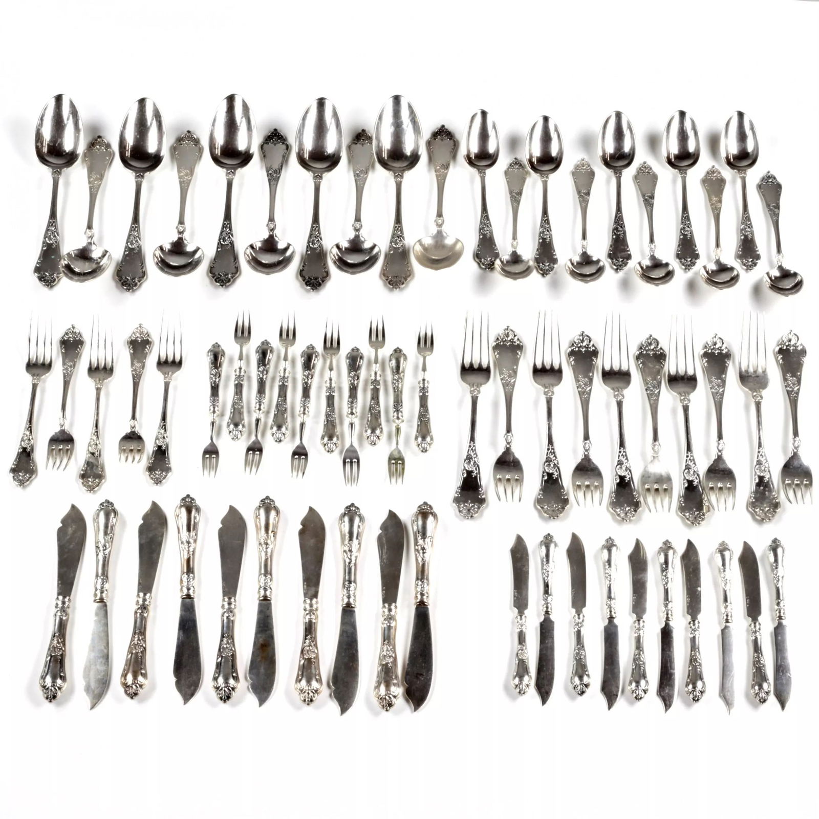 Silver table set by G. Klingert.: Table set of royal Russian silver, 84 assay value, workshop of Gustav Klingert. Moscow 1908-1917. Full-weight classic forms of the product are combined with whimsical and precise curls of baroque deco