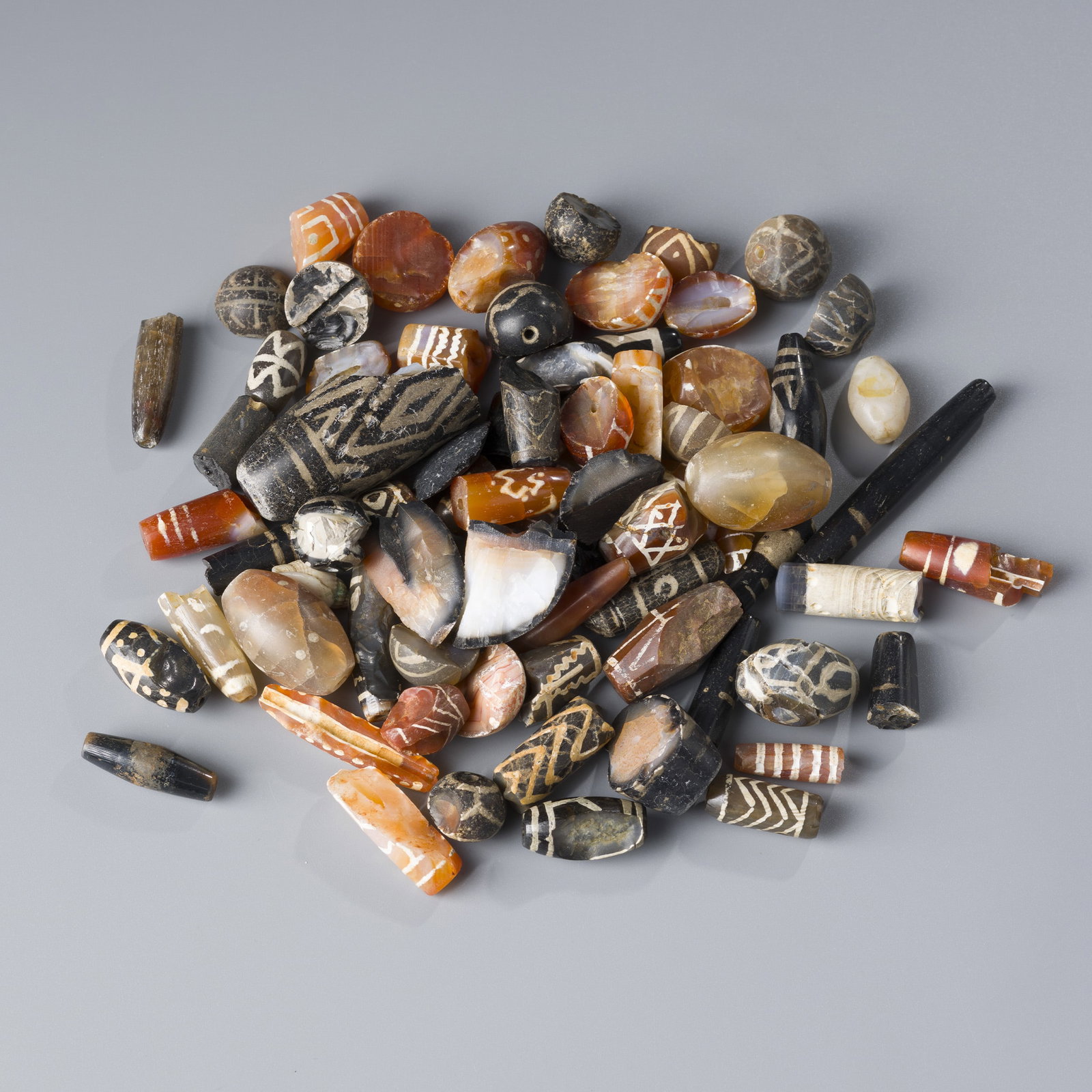 Group of Himalayan Tibetan Decorated Agate Stone Beads (Damaged) [380g]: A Group of old Himalayan Tibetan decorated agate beads, totaling 380 grams. While all beads show signs of damage and wear.