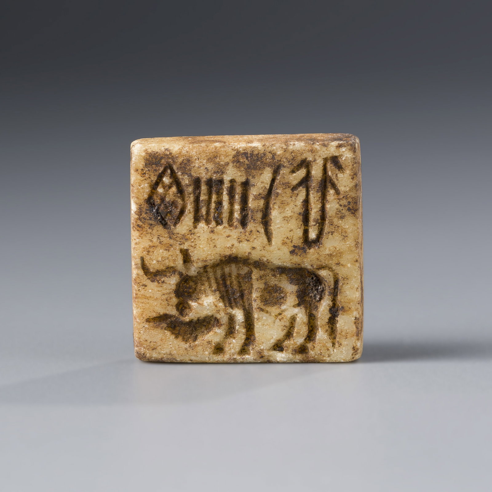 Ancient Indus Valley Stone Bull Intaglio Seal Stamp: Indus Valley civilization, featuring a detailed bull motif. Measuring approximately 2.7 x 2.7 cm and weighing 14 grams.