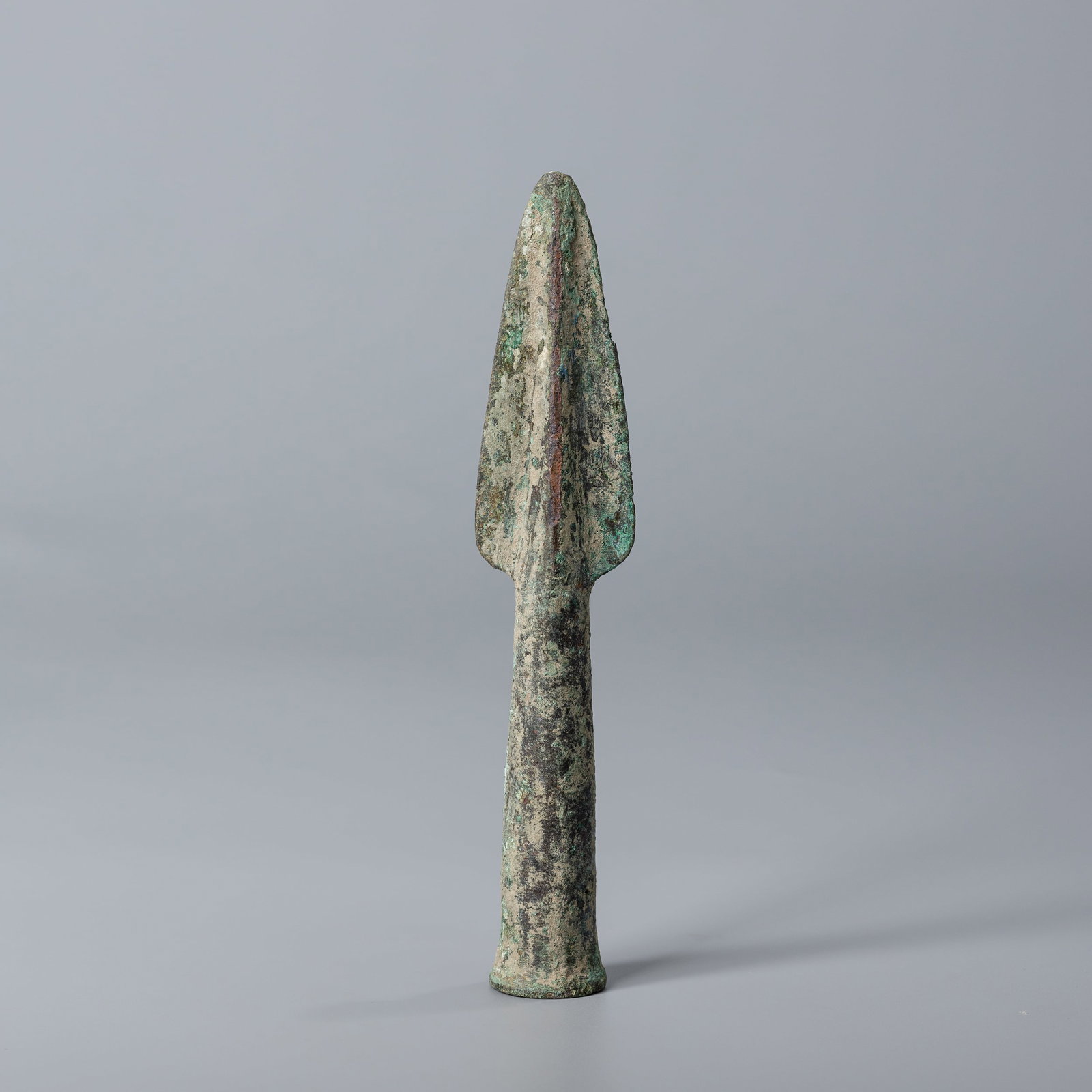 Antique Greek Greco-Bactrian Bronze Socketed Spear Head: Bronze socketed spear head dating from the Greek Greco-Bactrian period. Measuring 3 x 16 cm and weighing 123 grams, this antique piece features aged patina and fine craftsmanship.