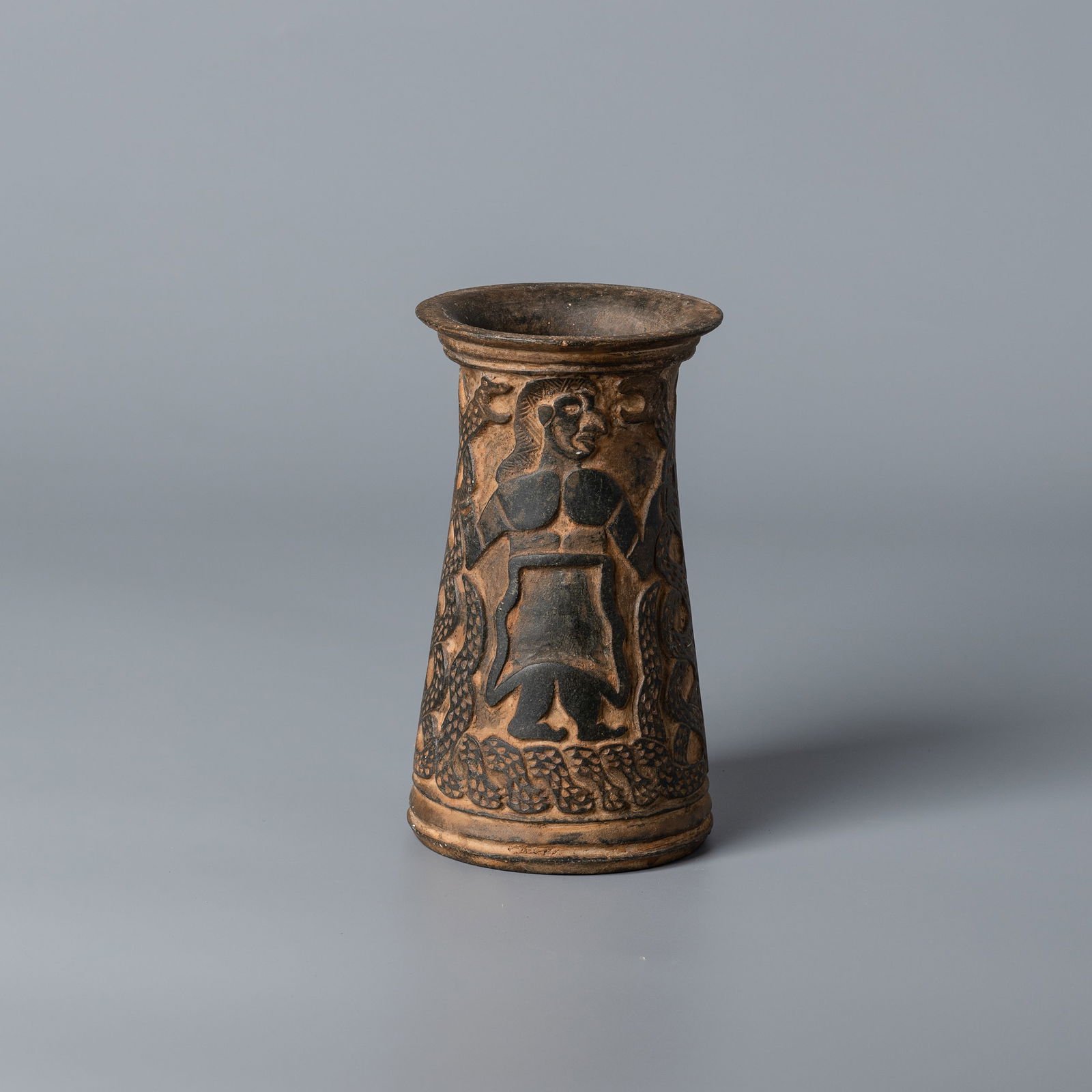 Near Eastern Western Asiatic Chlorite Vase with Carved Figural Scene and Patterned Design: A chlorite stone vase from the Western Asiatic region, finely carved with an engaging figural scene and decorative geometric patterns.Dimensions:Height: 8.7 cmDiameter: 15.5 cmWeight:672 grams