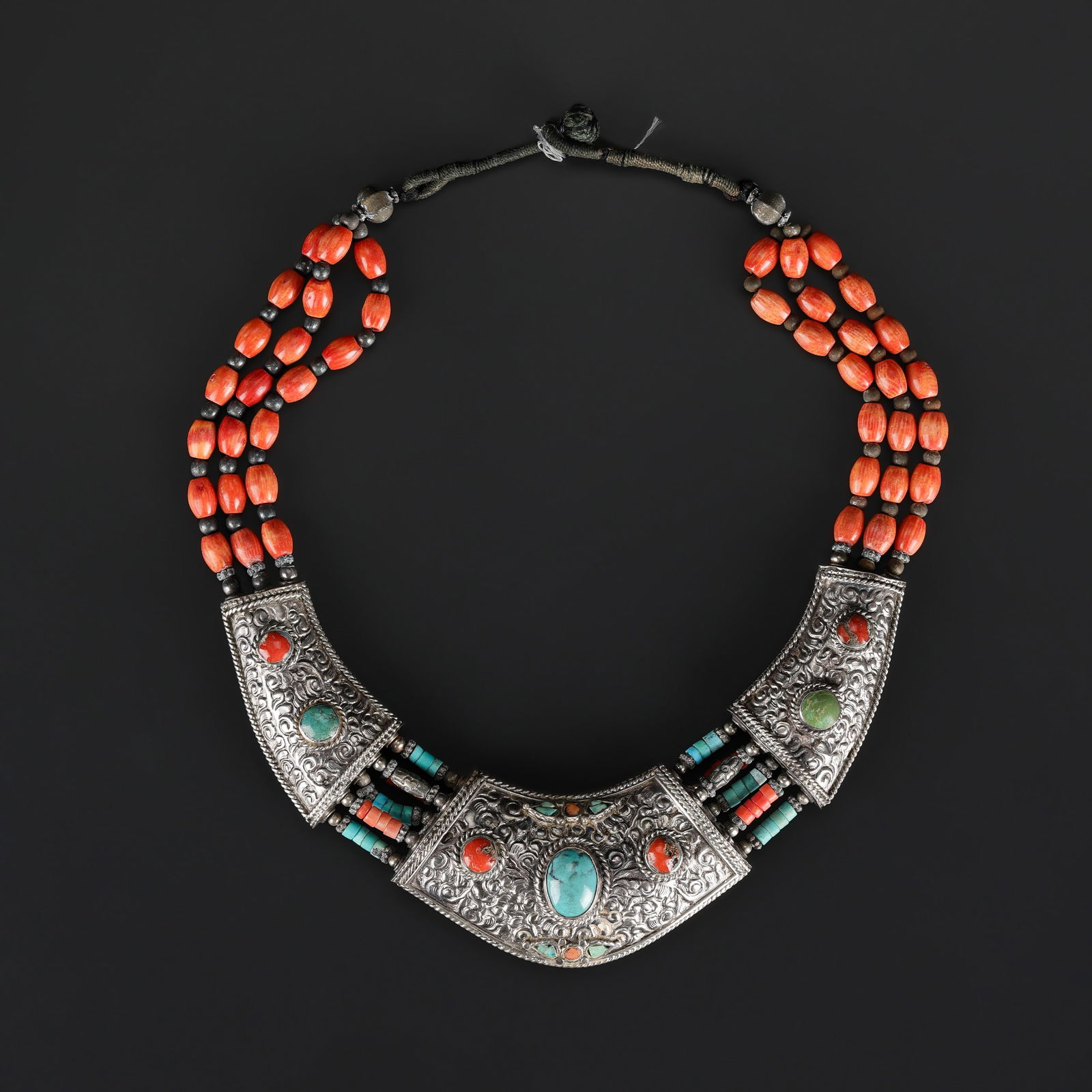 Tibetan Artisan Necklace – Metal Pendant with Coral & Turquoise: Unique handcrafted Tibetan metal pendant necklace, adorned with vibrant coral and turquoise & string coral beads. Ethnic design with artisanal charm, perfect for collectors or bohemian style Total Wei