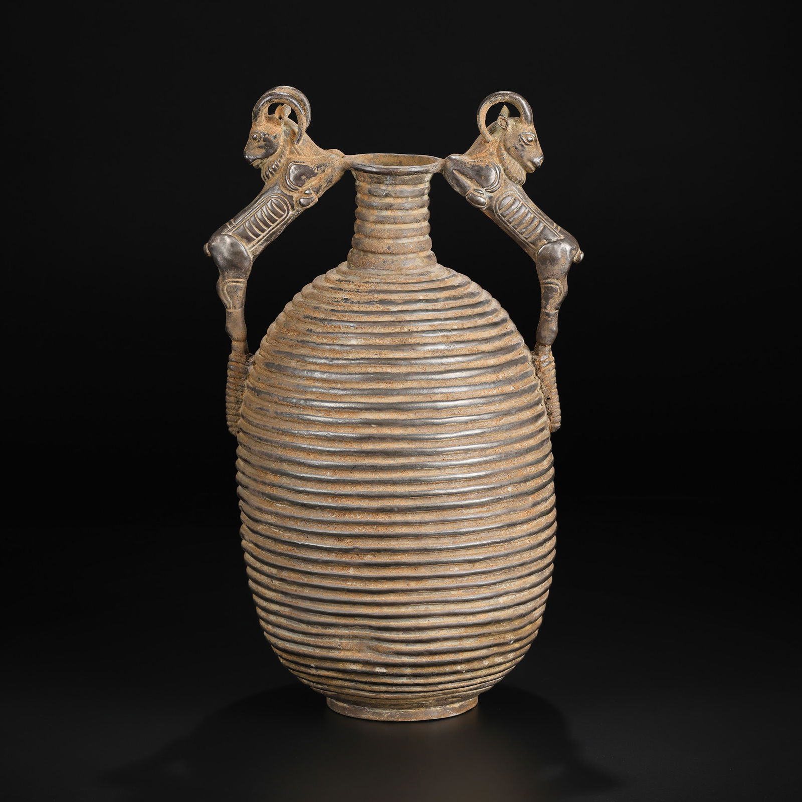 Near Eastern Bactrian–Persian Silver Ritual Vessel with Twin Ram Handles: A finely crafted silver ritual vessel adorned with twin ram-head handles Size Detail: 20 x 34cm Weight: 734gram