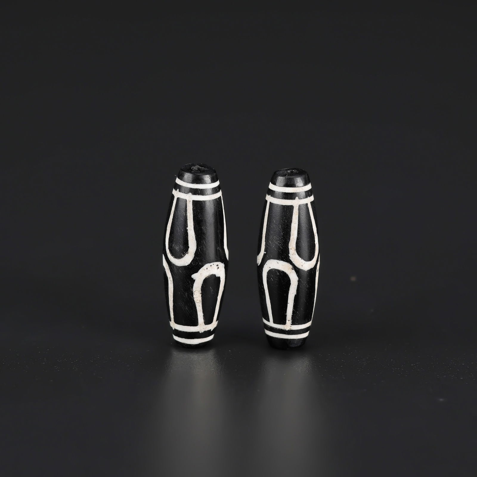 Pair of Rare Lotus Pattern Phum Dzi Beads — Tibetan Himalayan Agate Amulets: A pair of Tibetan Himalayan Phum Dzi agate beads showcasing a rare lotus pattern. Total Weight: 7gram