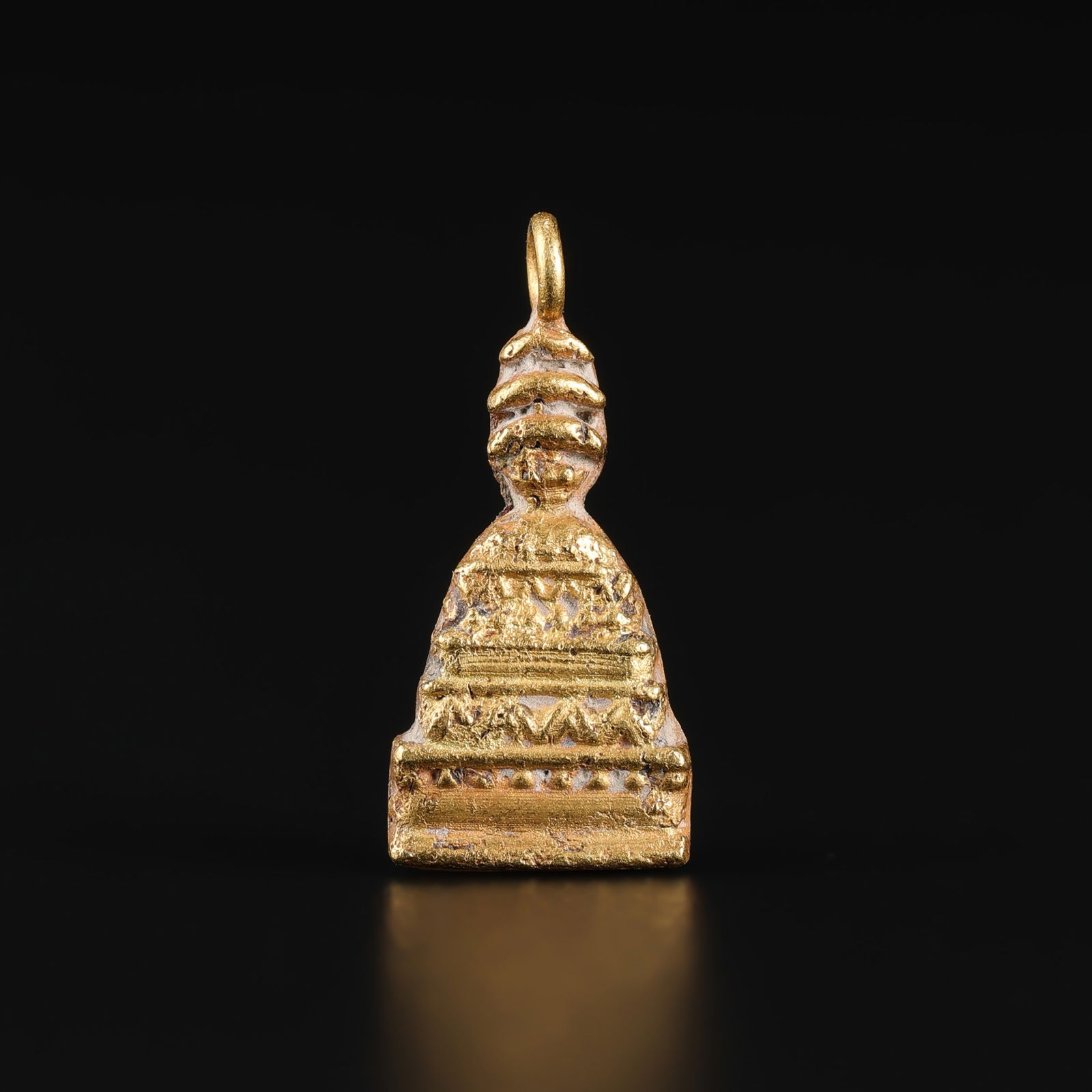 Gandhara Buddhist Stupa Motif 19K Gold Pendant: Pendant crafted in 19K gold, featuring a Buddhist stupa motif in Gandhara style. Size Detail: 0.8 x 1.7cm Weight: 1gram