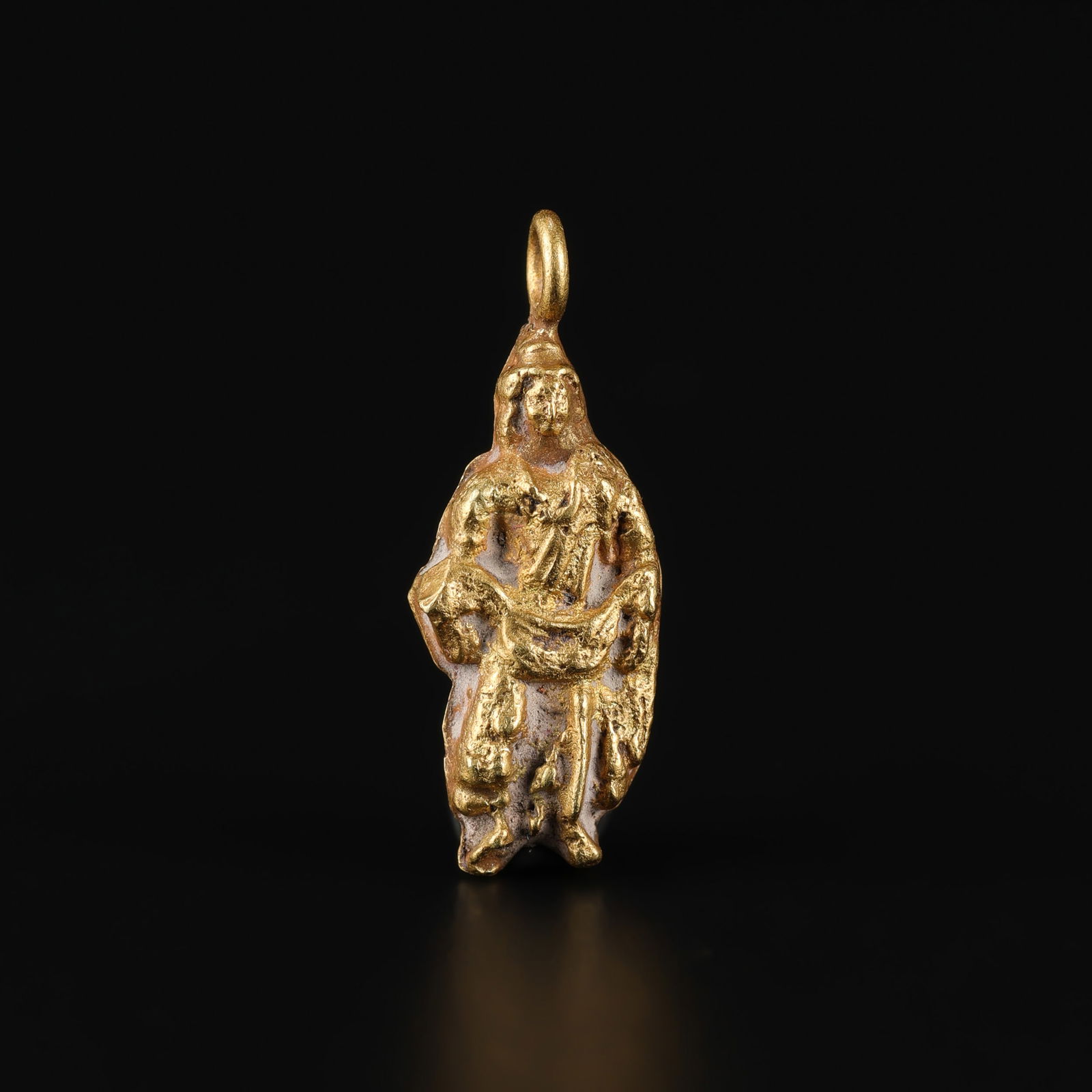Gandharan Bodhisattva Amulet, Solid 19K Gold Pendant: A Gandharan Bodhisattva amulet crafted entirely of solid 19K gold Size Detail: 0.6 x 1.7cm Weight: 0.9gram