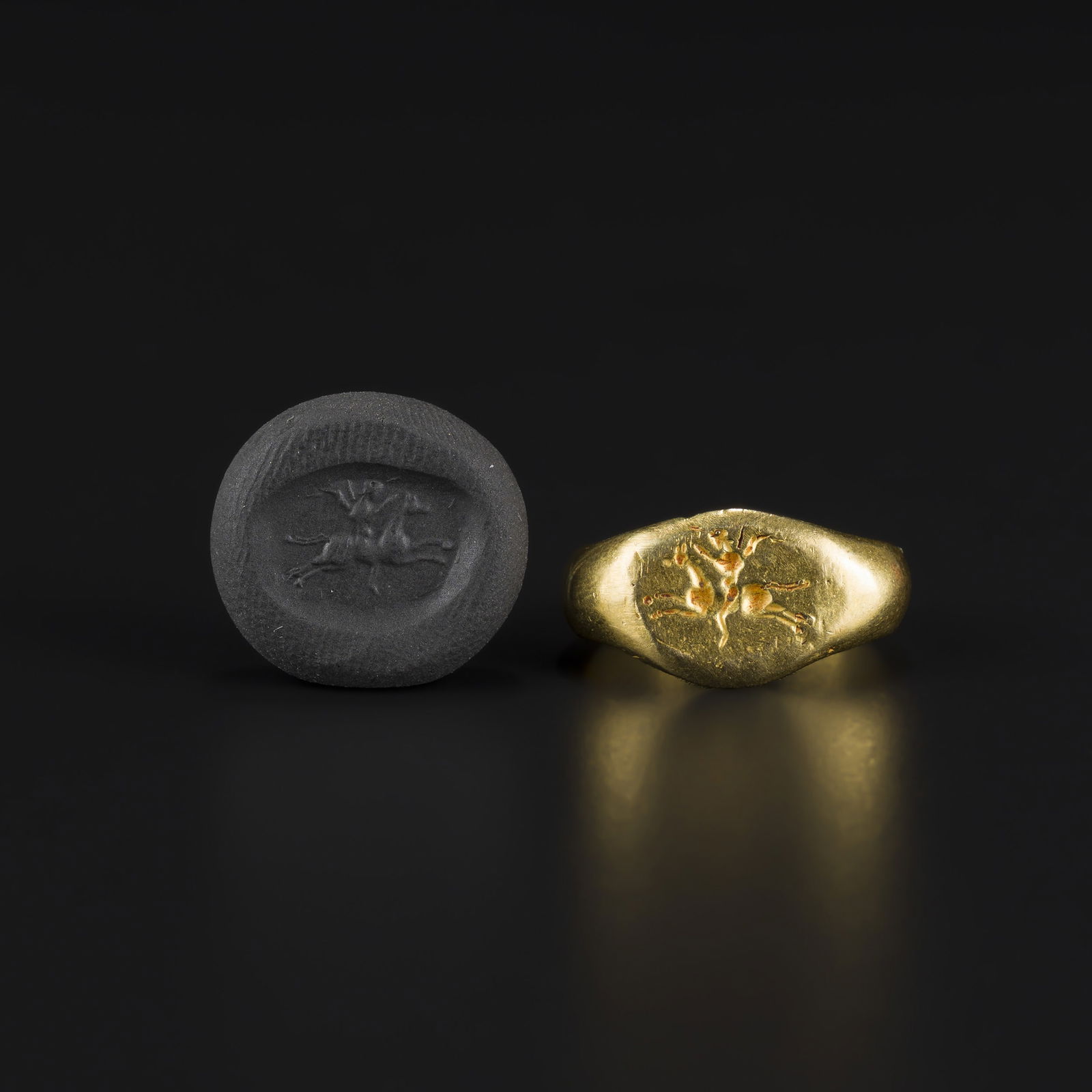 Ancient Roman Solid Gold Ring with Intaglio of Man Riding a Horse: An Ancient Roman solid gold ring with a bezel carved in relief depicting a man riding a horse. The finely detailed figure is directly engraved on the gold. Weight: 8gram