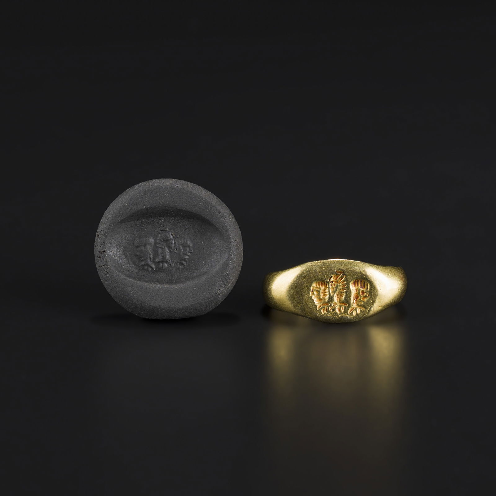 Ancient Roman Solid Gold Ring with Three Human Profile Intaglios: An Ancient Roman solid gold ring (size 7.5, weight 6 g) featuring three finely engraved human profiles in intaglio on the bezel. Weight: 6gram