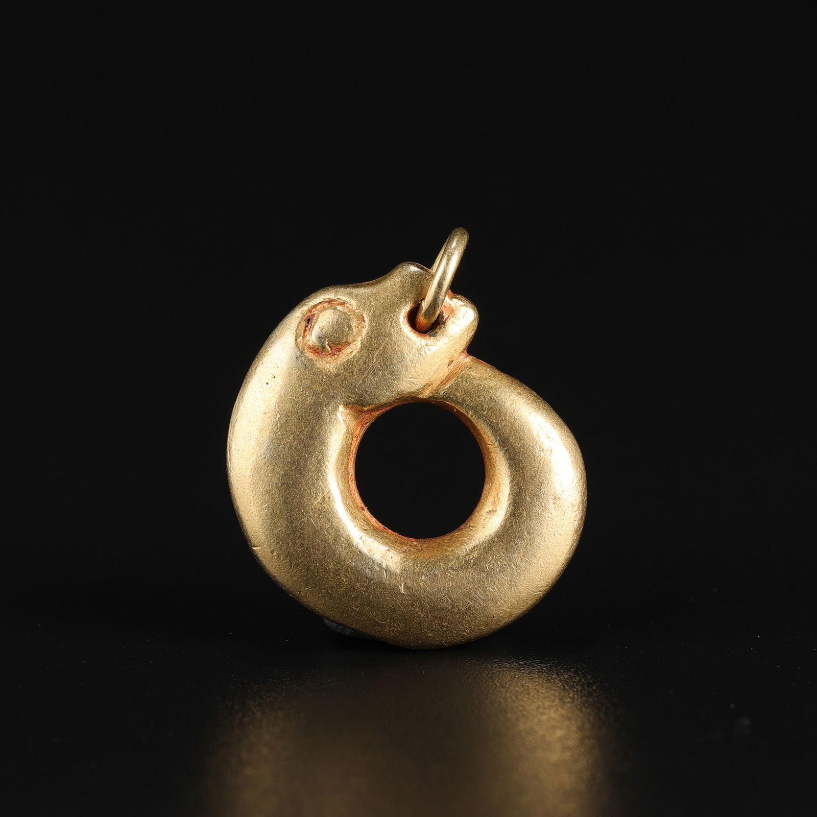 Ancient Bactrian-Roman Solid Gold Snake Motif Amulet Pendant: An Ancient Bactrian-Roman amulet pendant crafted in solid gold, weighing 11 g, featuring a finely rendered snake motif. Size Detail: 1.8 x 2cm Weight: 11gram
