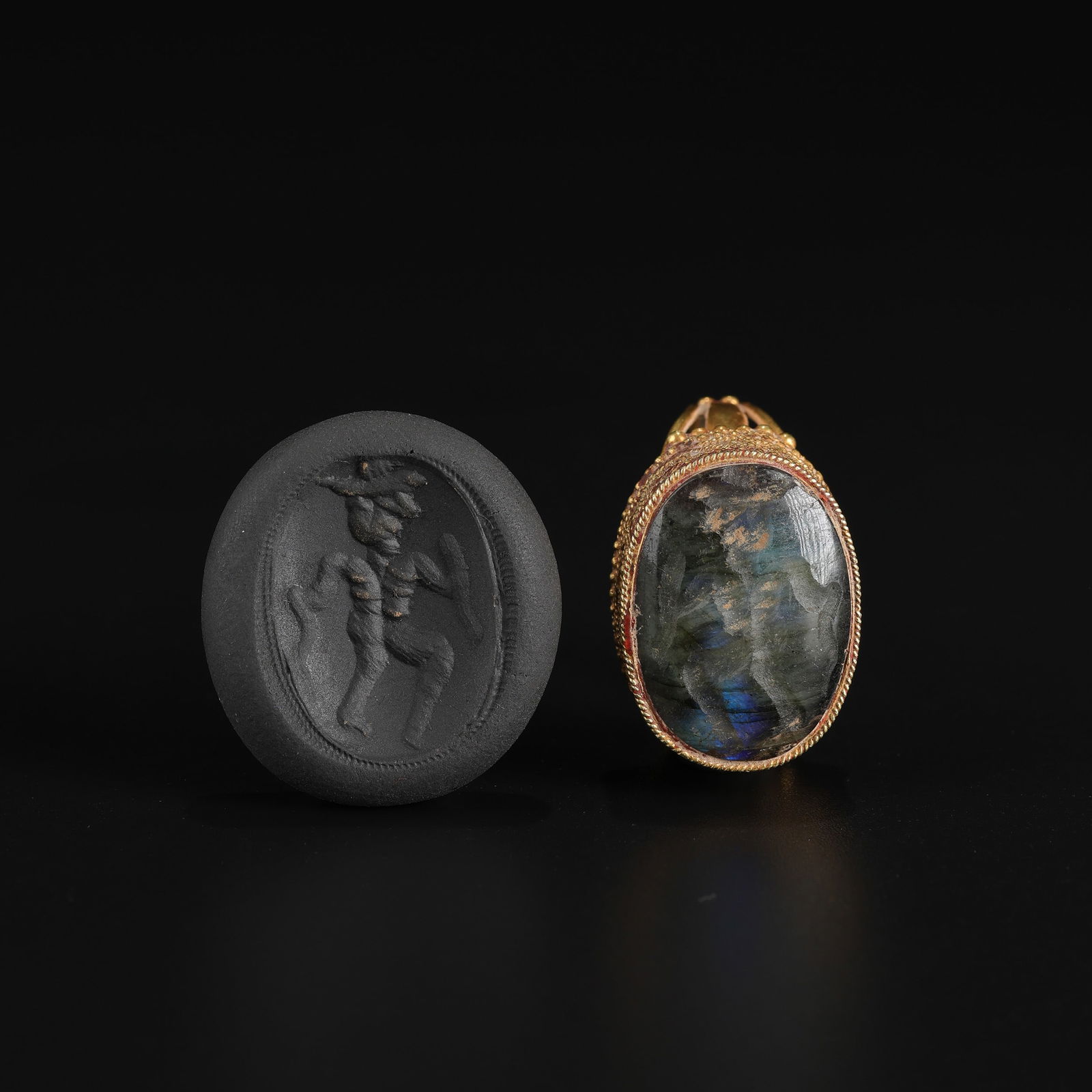 Ancient Bactrian-Hellenistic Greek Gold Ring with Gemstone Intaglio Seal: An Ancient Bactrian-Hellenistic Greek ring crafted in 16K gold, featuring a gemstone intaglio seal engraved on the bezel. Total Weight: 17gram