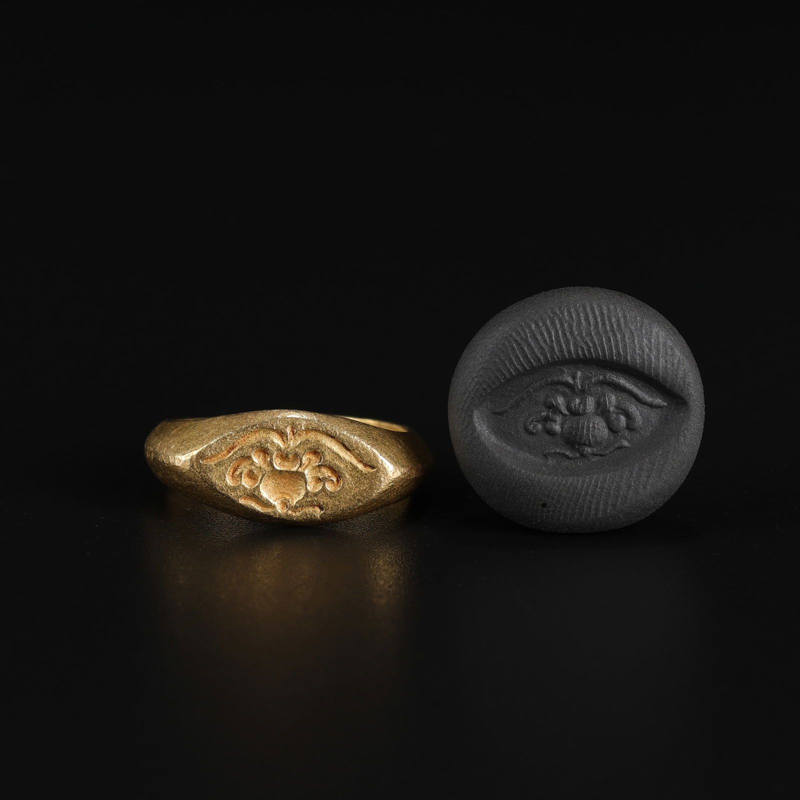 Southeast Asian Pagan Dynasty Gold Ring with Intaglio Stamp: An Ancient Southeast Asian ring from the Pagan Dynasty, crafted in 18K gold, featuring an intaglio stamp engraved on the bezel. Total Weight: 8gram