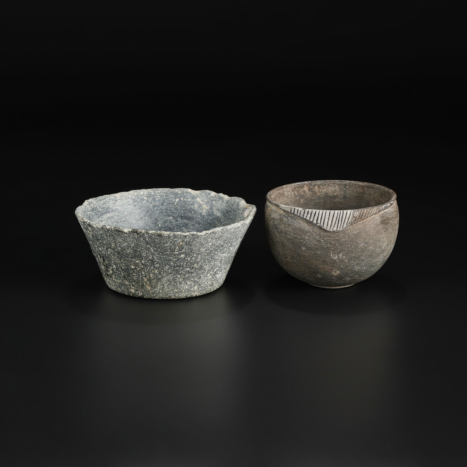 Lot of 2 Ancient Western Asia Iron Age Stone Bowls: Lot of two ancient Western Asian stone bowls dating to the Iron Age. Simple, utilitarian forms carved from stone, representative of early regional craftsmanship. Total Weight: 559gram