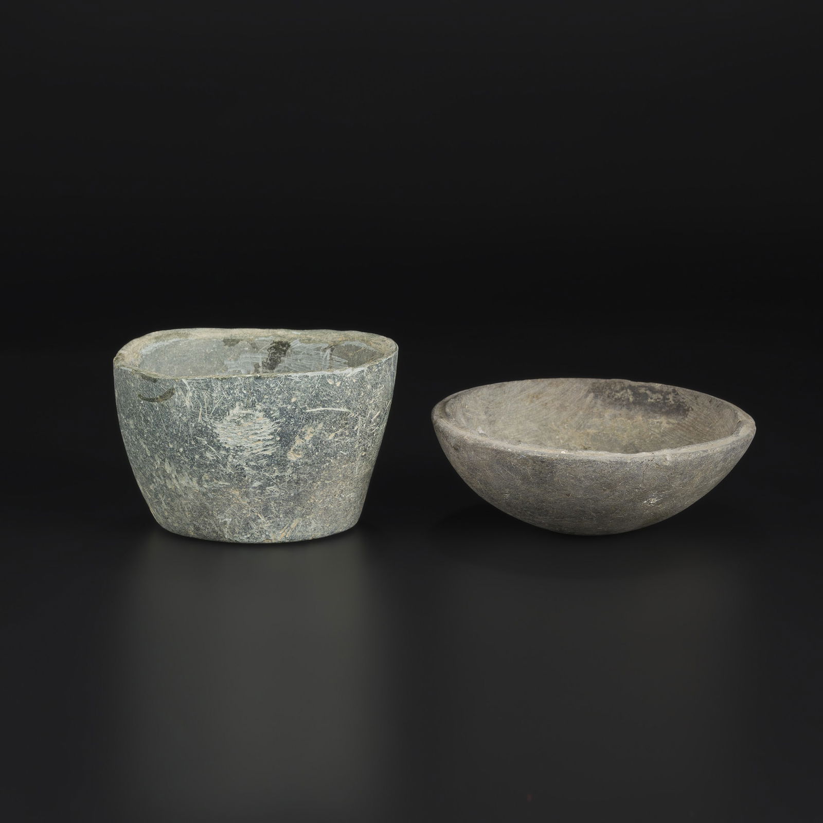 Lot of 2 Ancient Western Asia Iron Age Stone Bowls: Lot of two ancient Western Asian stone bowls dating to the Iron Age. Carved from stone. Total Weight: 1.2kg