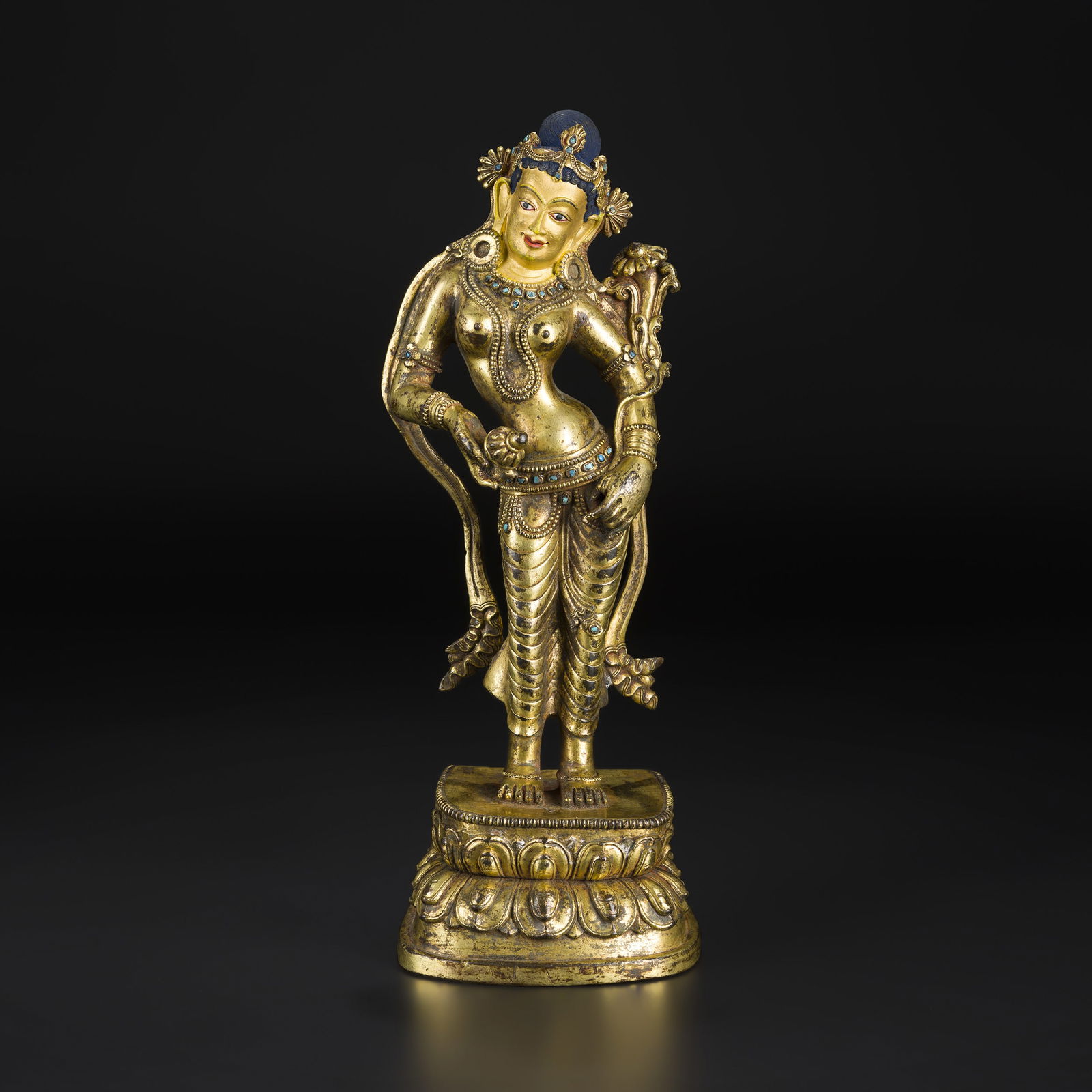 Qing Dynasty Tibetan Gilt Bronze Figure of Standing Tara on Lotus Base: Qing Dynasty Tibetan gilt bronze figure depicting the standing Tara on a lotus base. Finely cast with intricate details. Size Detail: 10 x 27cm Weight: 1.9kg