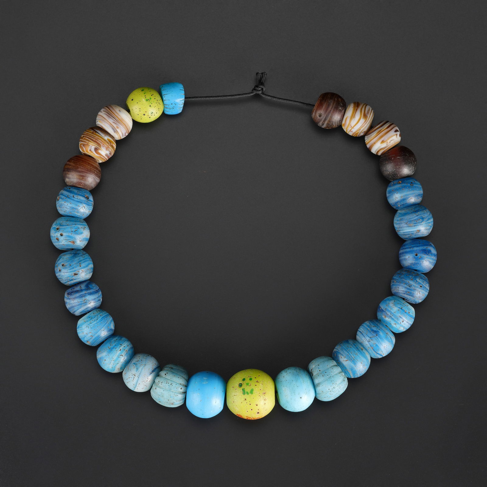 Lot of Antique Multicolor Blue Glass Circular Beads: Lot of antique circular glass beads in shades of blue and multicolor. Length: 18in Total Weight: 302gram