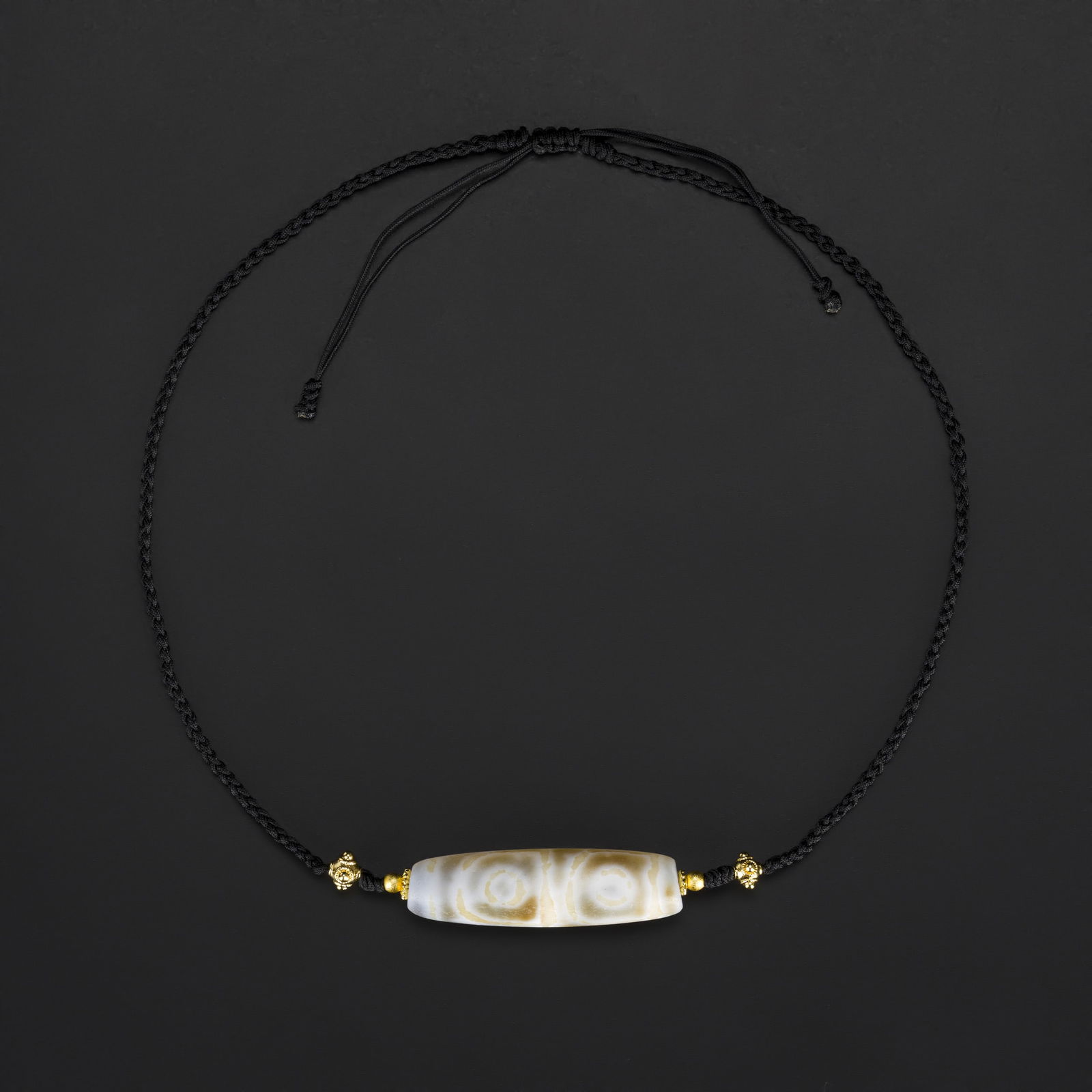 Tibetan 4-Eyed Dzi Agate Bead Necklace – Handcrafted Design: Rare Tibetan 4-eyed Dzi agate bead, beautifully designed as a finished necklace. Strung and hand-knotted on soft fabric with careful attention to layout and aesthetics, creating a harmonious and elega