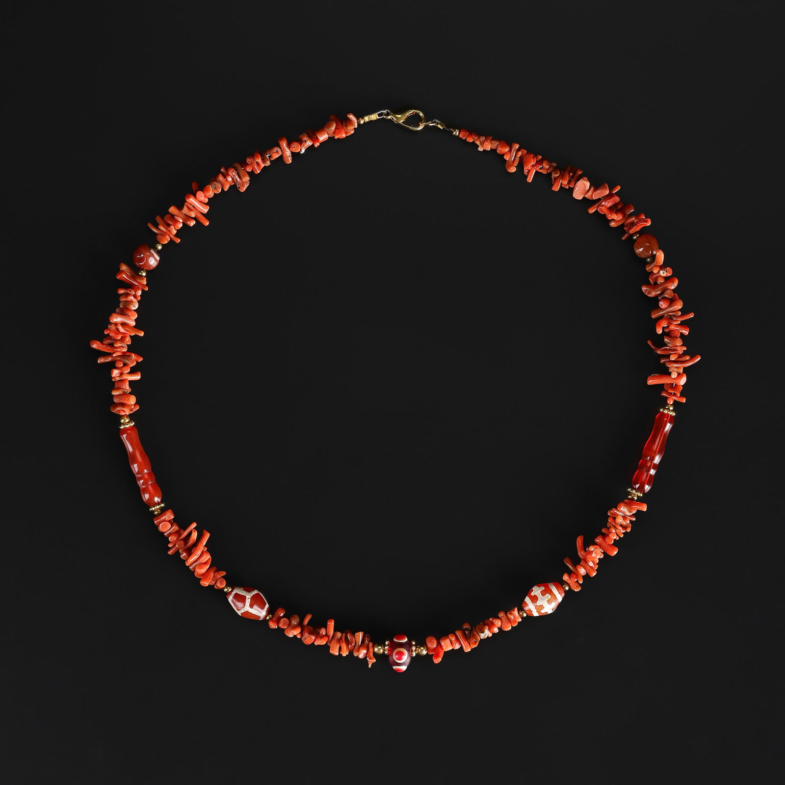 A Vintage Natural Coral and Assorted Bead Necklace: A vintage necklace featuring natural coral beads combined with assorted beads of varied materials and colors. Length: 20in Total Weight: 29gram