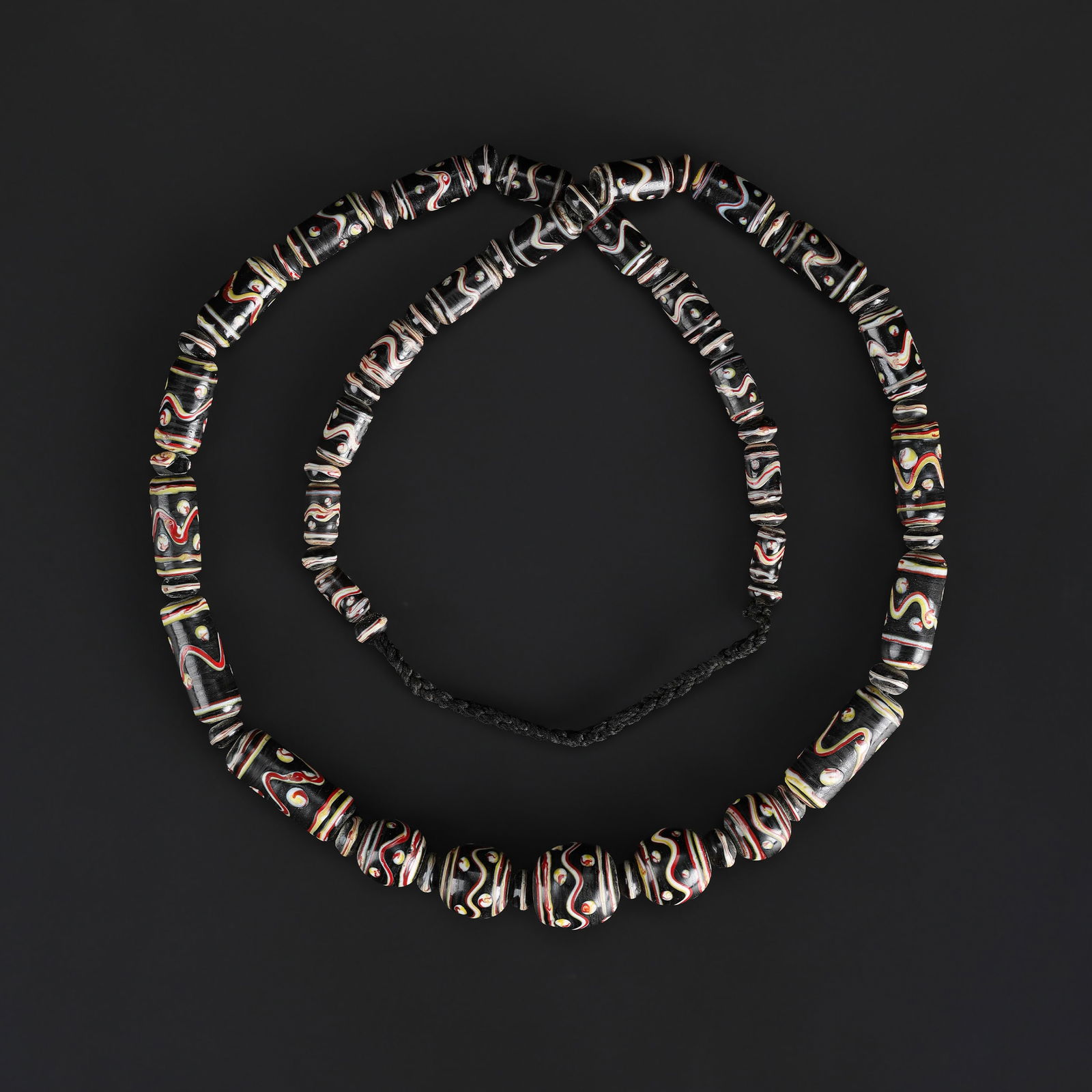 A Strand of Antique Glass Trade Beads: A Strand of Antique Glass Trade Beads Length: 27in Total Weight: 110gram