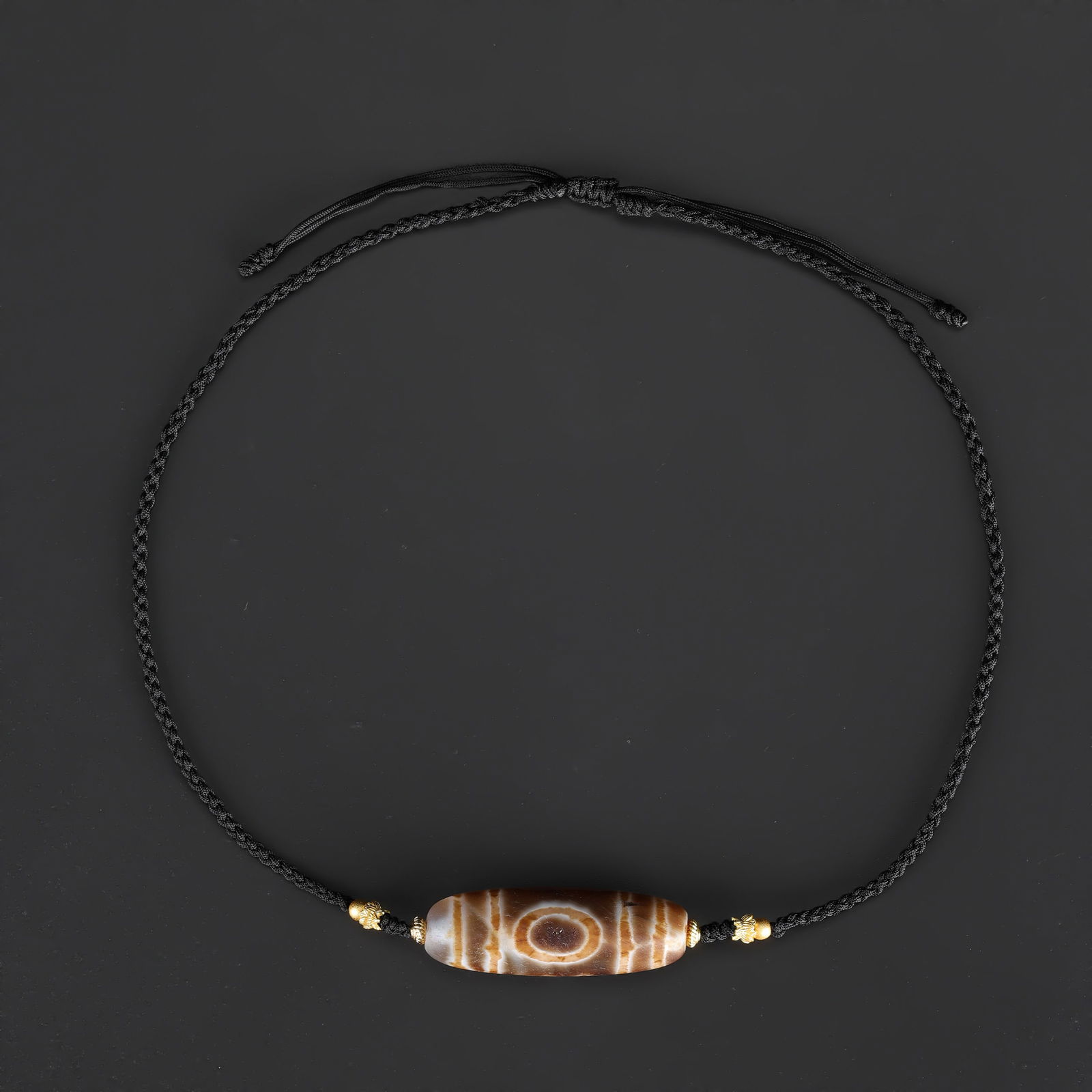 Tibetan Eye and Window-Pattern Dzi Agate Bead Necklace, Hand-Knotted: A Tibetan Dzi agate bead necklace featuring eye and window-pattern motifs, carefully hand-knotted on soft fabric cord to form a wearable design. Total Weight: 17gram