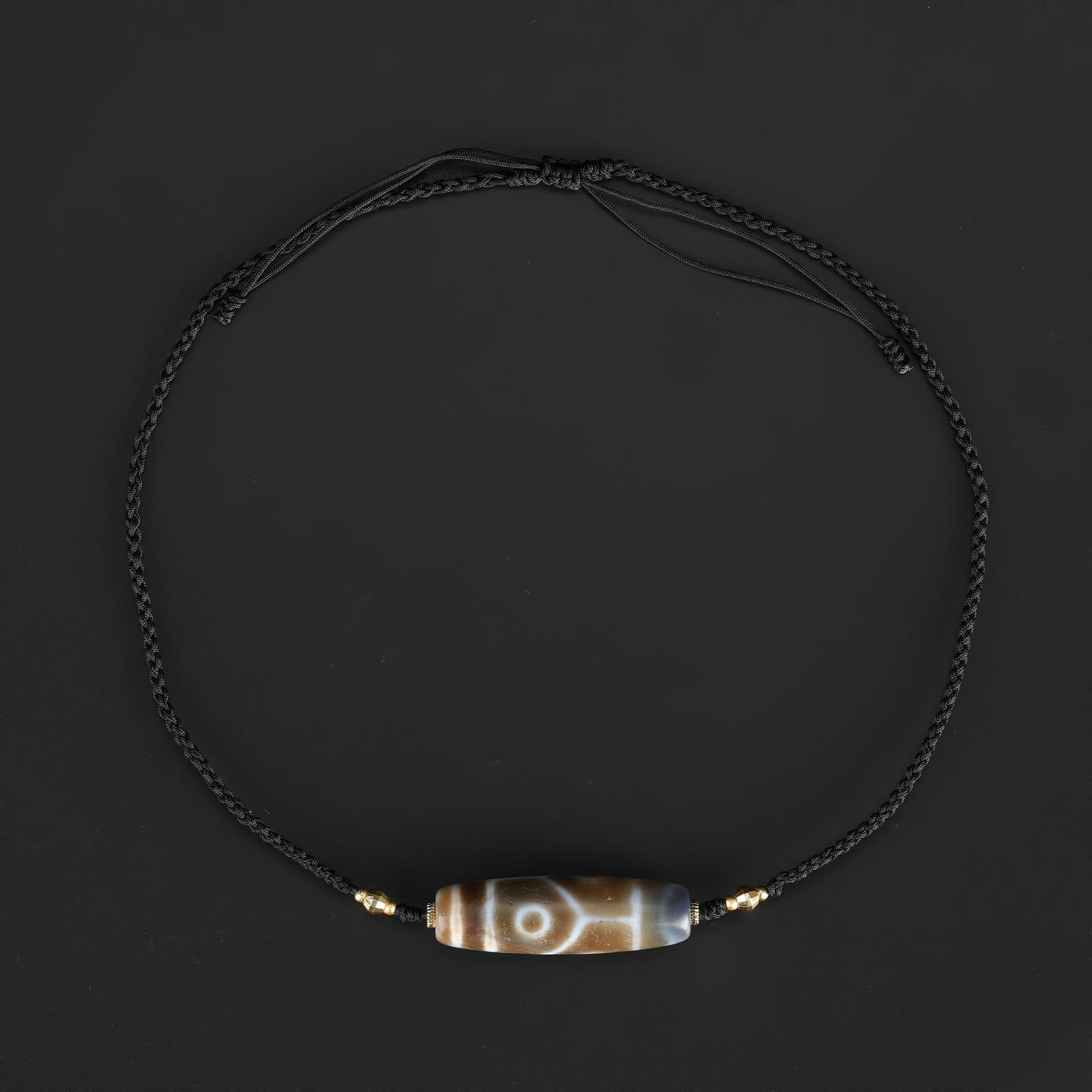 Tibetan 4-Eye Dzi Agate Bead Necklace, Hand-Knotted: A Tibetan Dzi agate bead necklace featuring 4-eye motifs, expertly hand-knotted on soft fabric cord to create a wearable design. Total Weight: 18gram